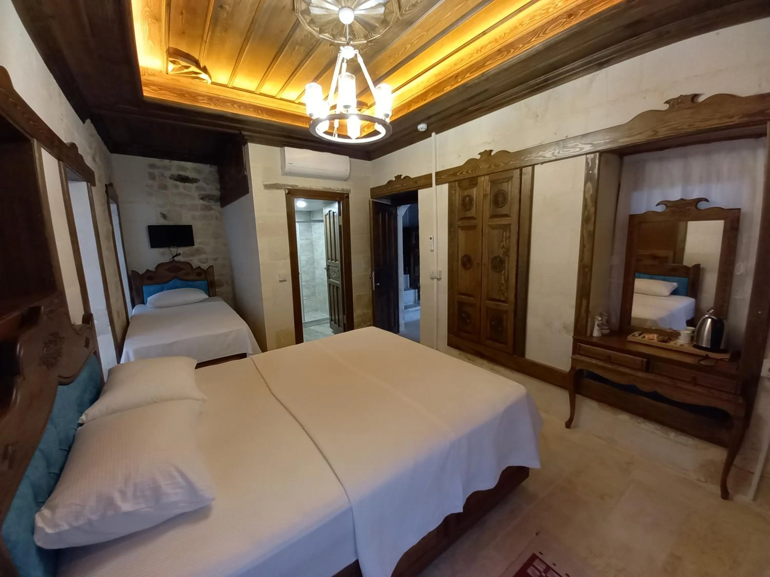 Bed in TÜRKMEN KONAGI HALFETİ BUTİK OTEL