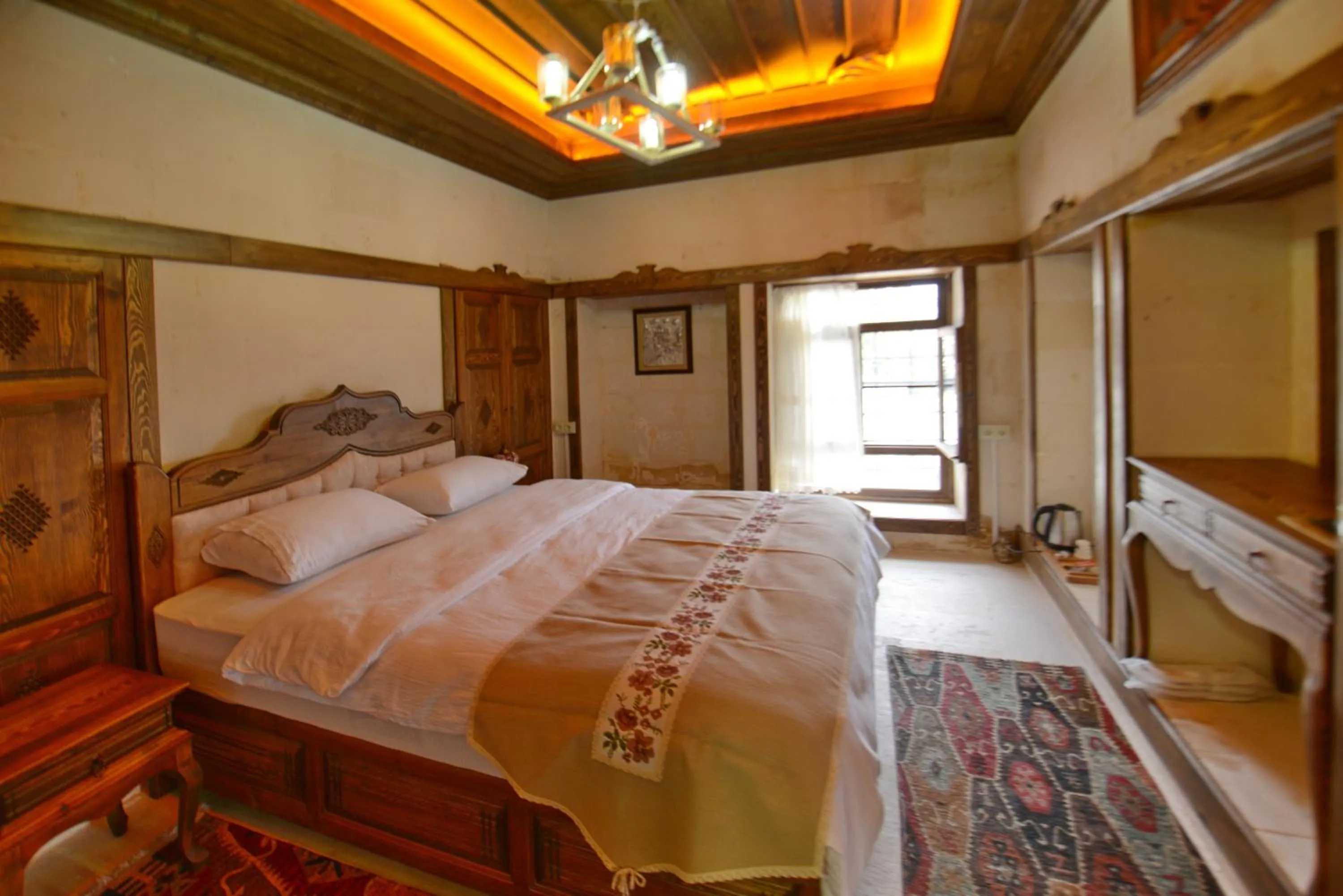 Bed in TÜRKMEN KONAGI HALFETİ BUTİK OTEL