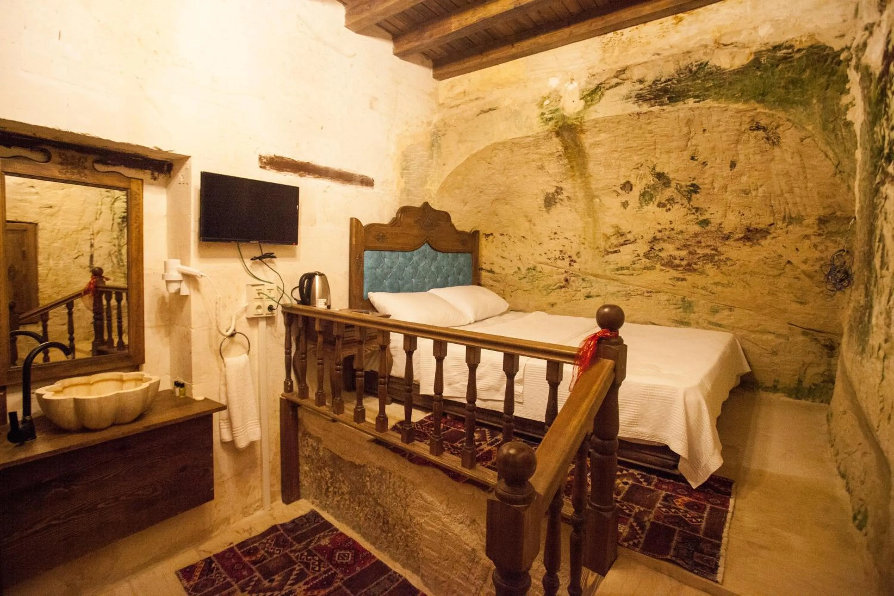 Bed in TÜRKMEN KONAGI HALFETİ BUTİK OTEL