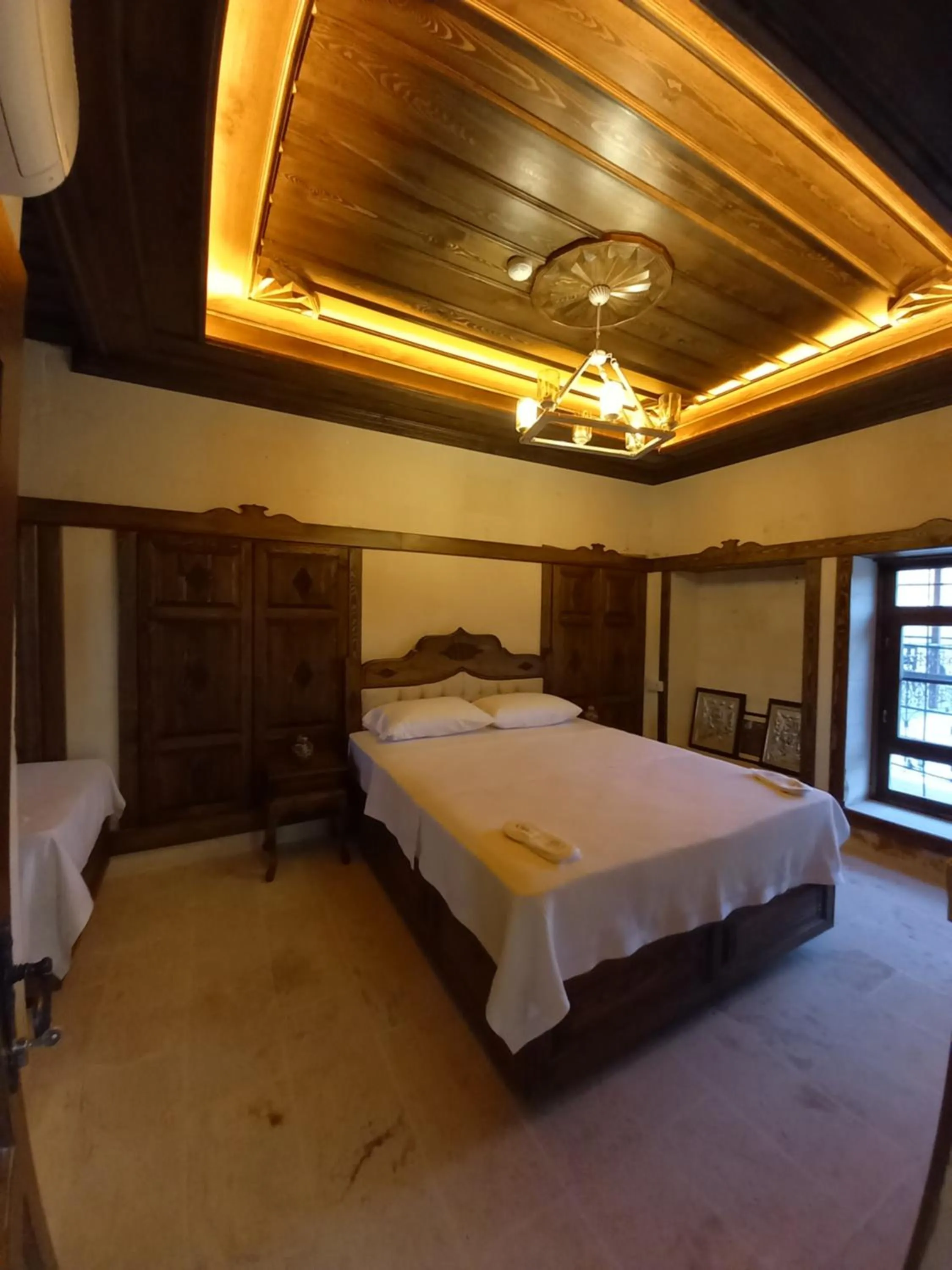 Bed in TÜRKMEN KONAGI HALFETİ BUTİK OTEL