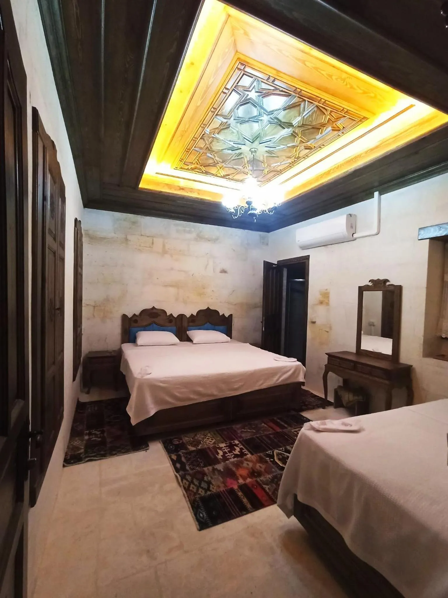 Bed in TÜRKMEN KONAGI HALFETİ BUTİK OTEL