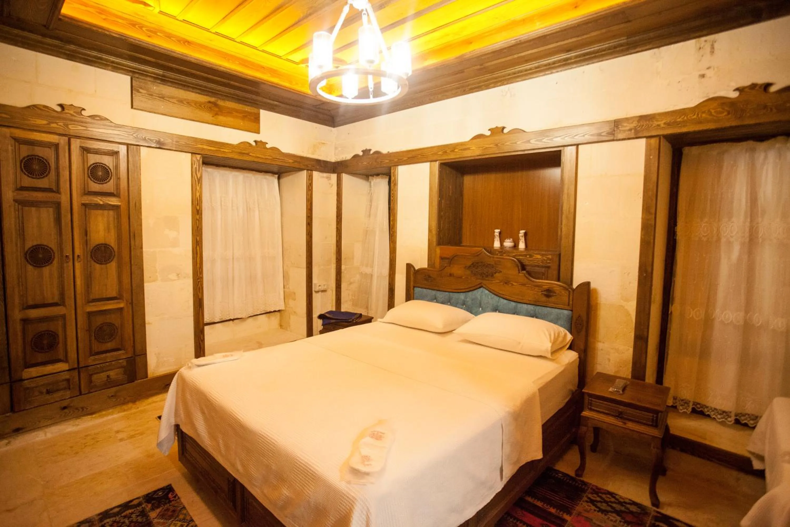 Bed in TÜRKMEN KONAGI HALFETİ BUTİK OTEL