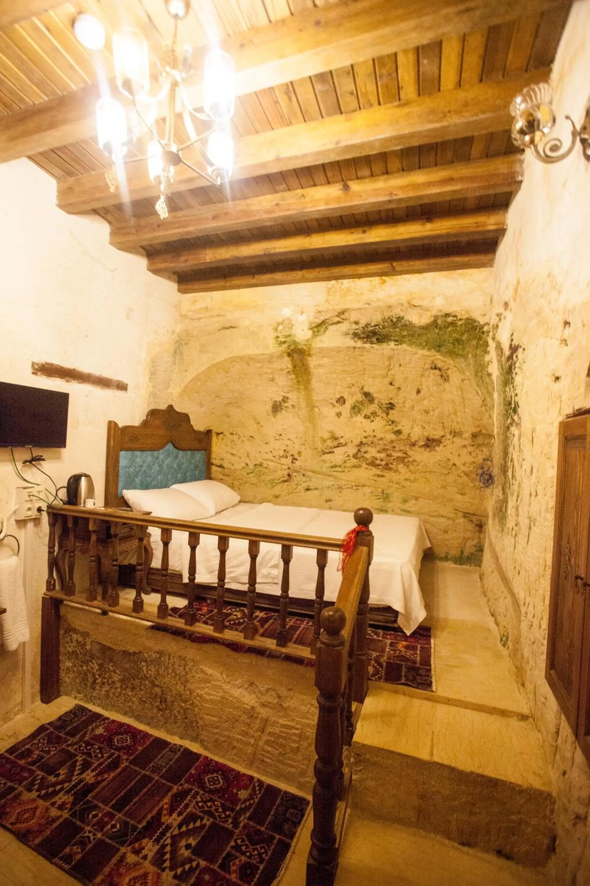 Bed in TÜRKMEN KONAGI HALFETİ BUTİK OTEL