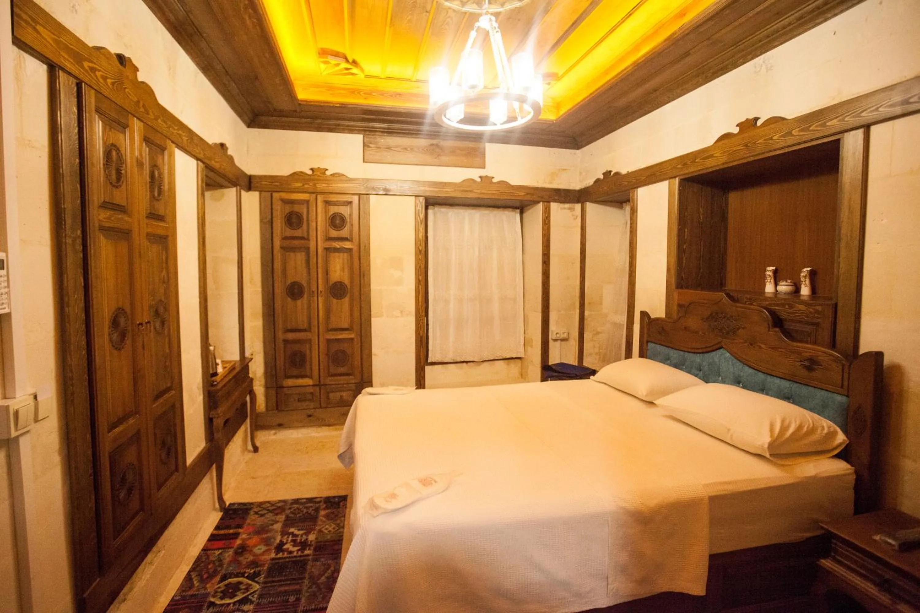 Bed in TÜRKMEN KONAGI HALFETİ BUTİK OTEL