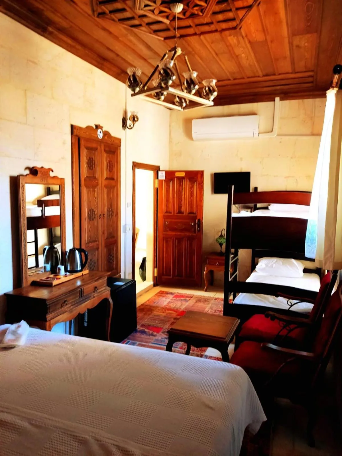 Bed in TÜRKMEN KONAGI HALFETİ BUTİK OTEL