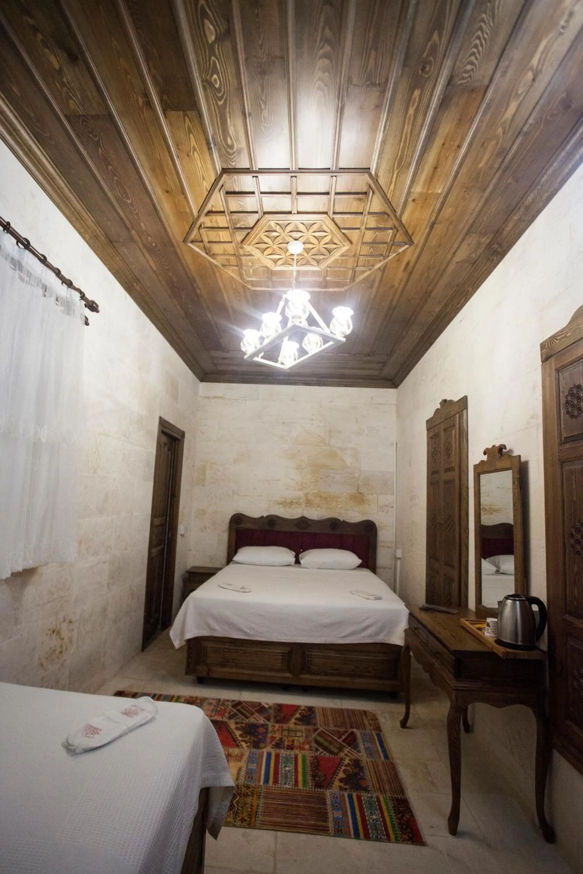 Bed in TÜRKMEN KONAGI HALFETİ BUTİK OTEL