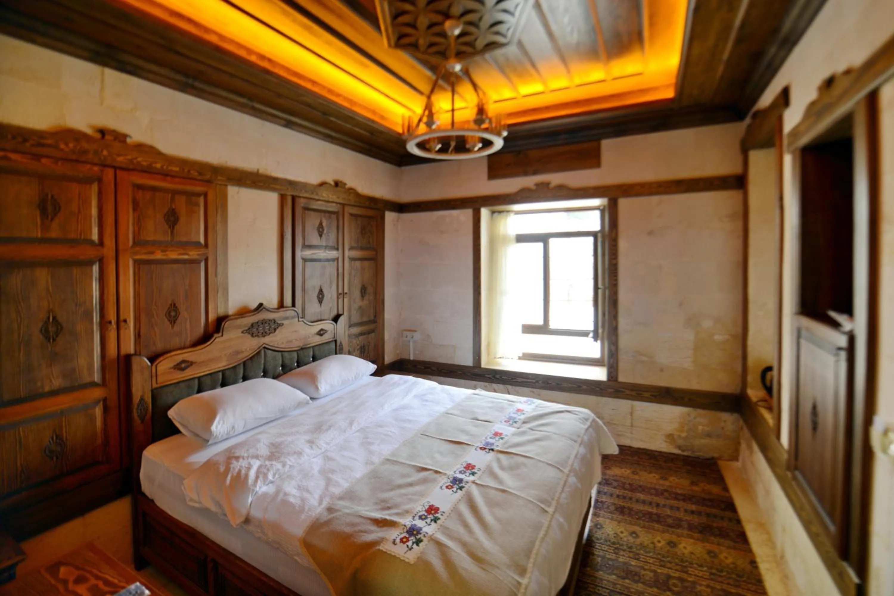 Bed in TÜRKMEN KONAGI HALFETİ BUTİK OTEL
