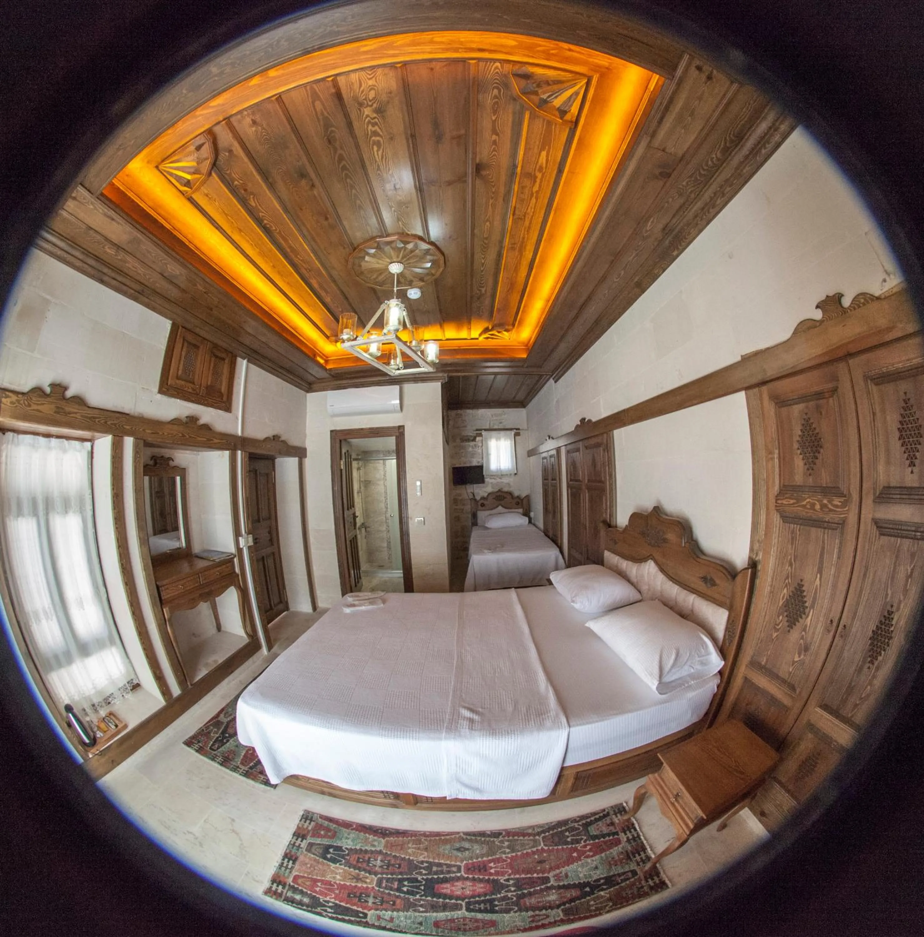 Bed in TÜRKMEN KONAGI HALFETİ BUTİK OTEL