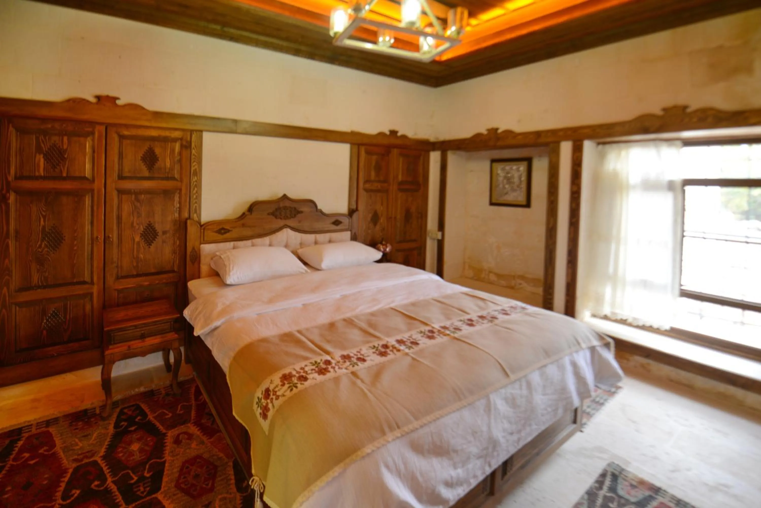 Bed in TÜRKMEN KONAGI HALFETİ BUTİK OTEL