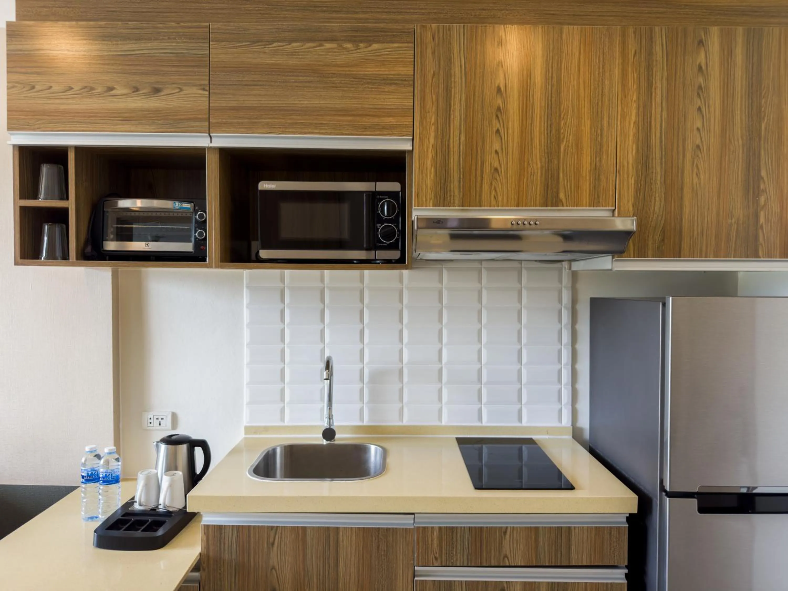 Kitchen or kitchenette in Ramada by Wyndham Bangkok Ten Ekamai Residences