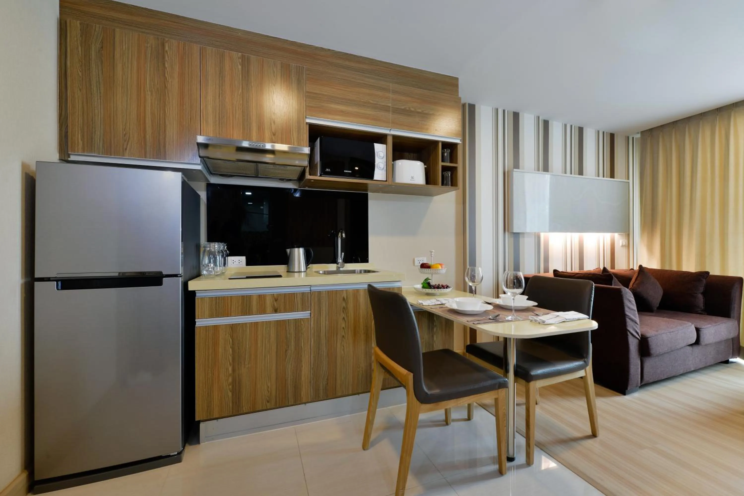 Kitchen or kitchenette in Ramada by Wyndham Bangkok Ten Ekamai Residences