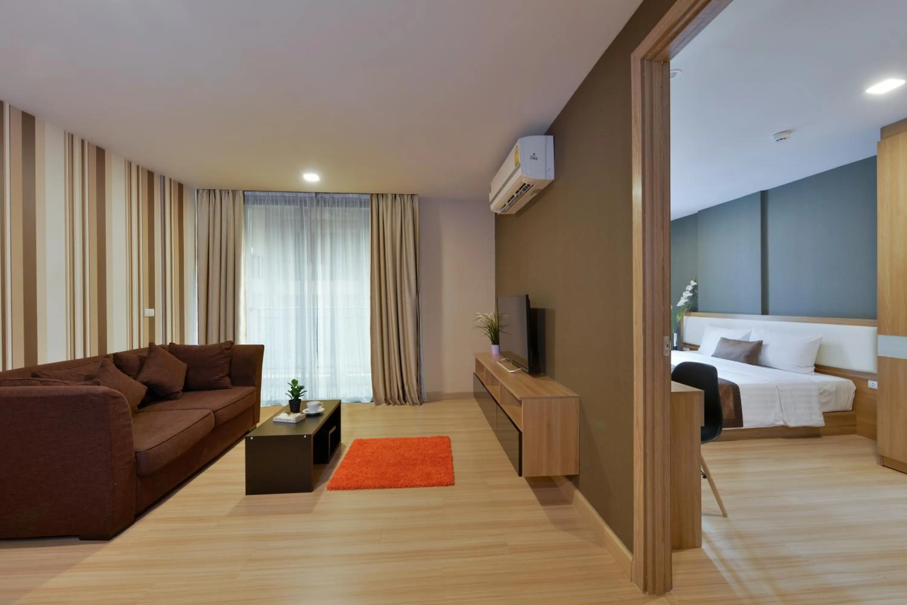 Living room in Ramada by Wyndham Bangkok Ten Ekamai Residences