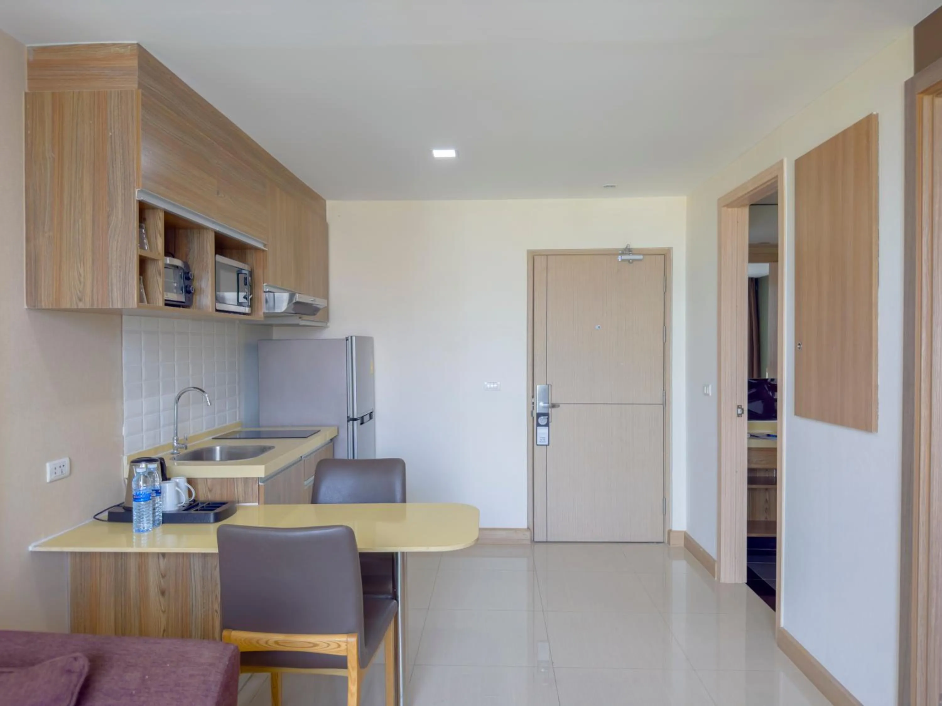 Kitchen or kitchenette in Ramada by Wyndham Bangkok Ten Ekamai Residences