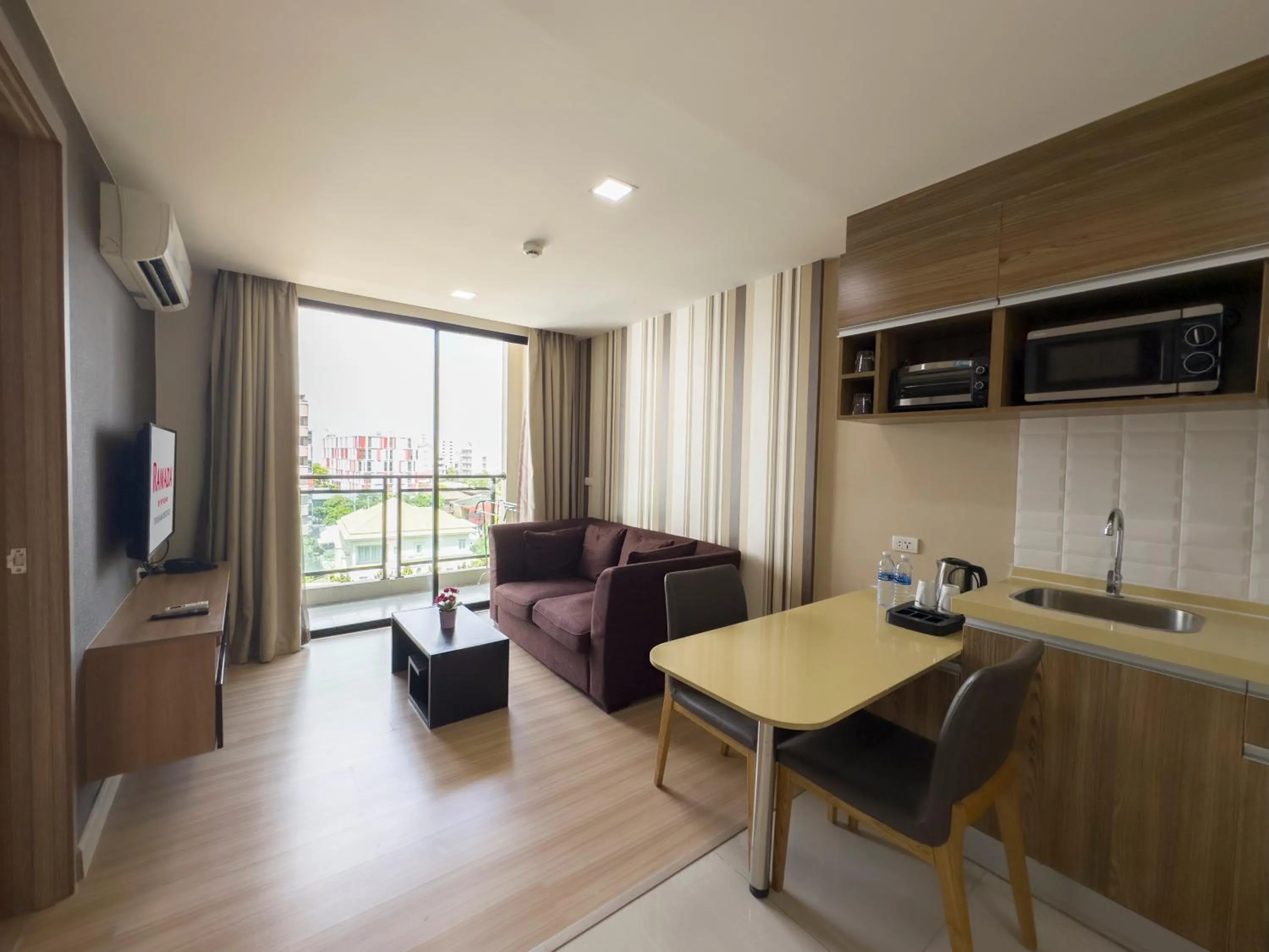 Living room in Ramada by Wyndham Bangkok Ten Ekamai Residences