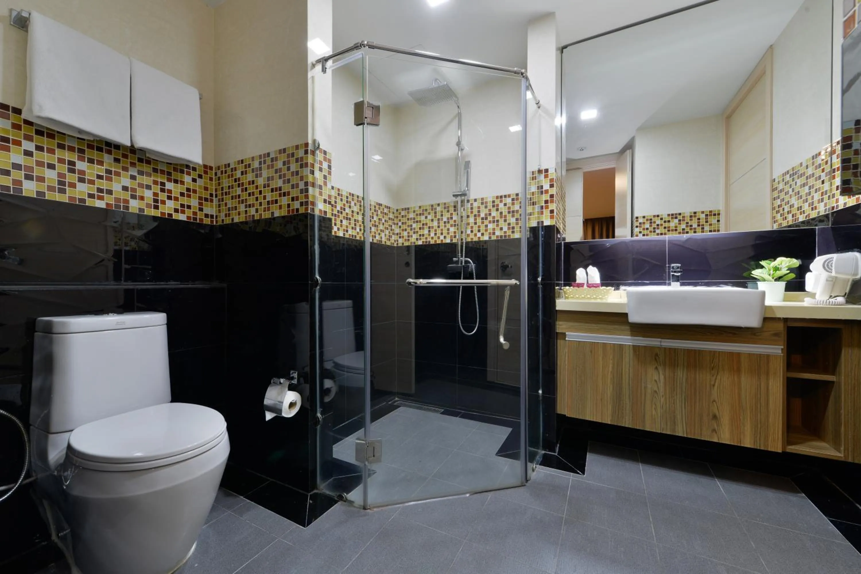 Shower in Ramada by Wyndham Bangkok Ten Ekamai Residences