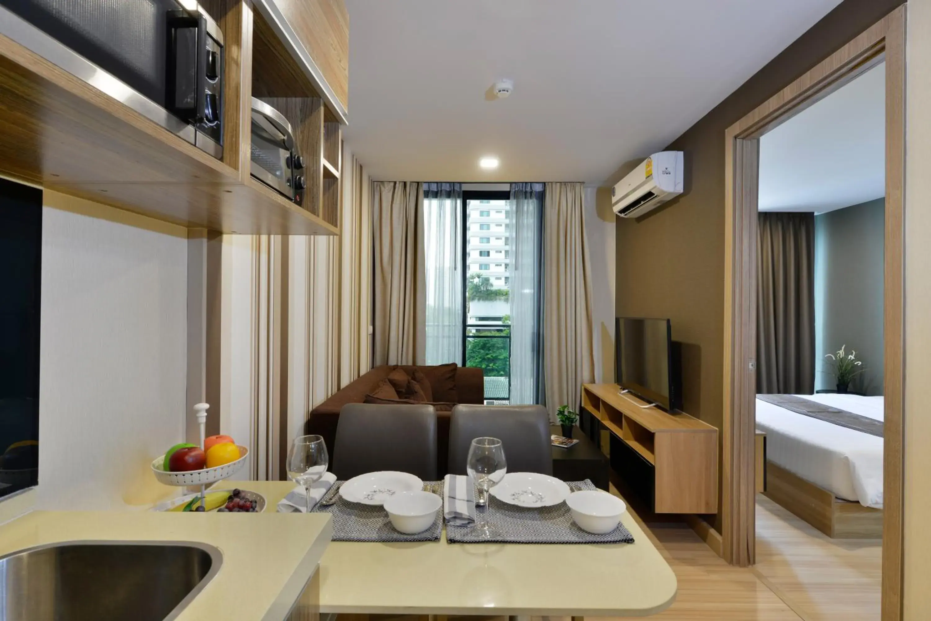 Living room, Bed in Ramada by Wyndham Bangkok Ten Ekamai Residences Living room, Bed in Ramada by Wyndham Bangkok Ten Ekamai Residences