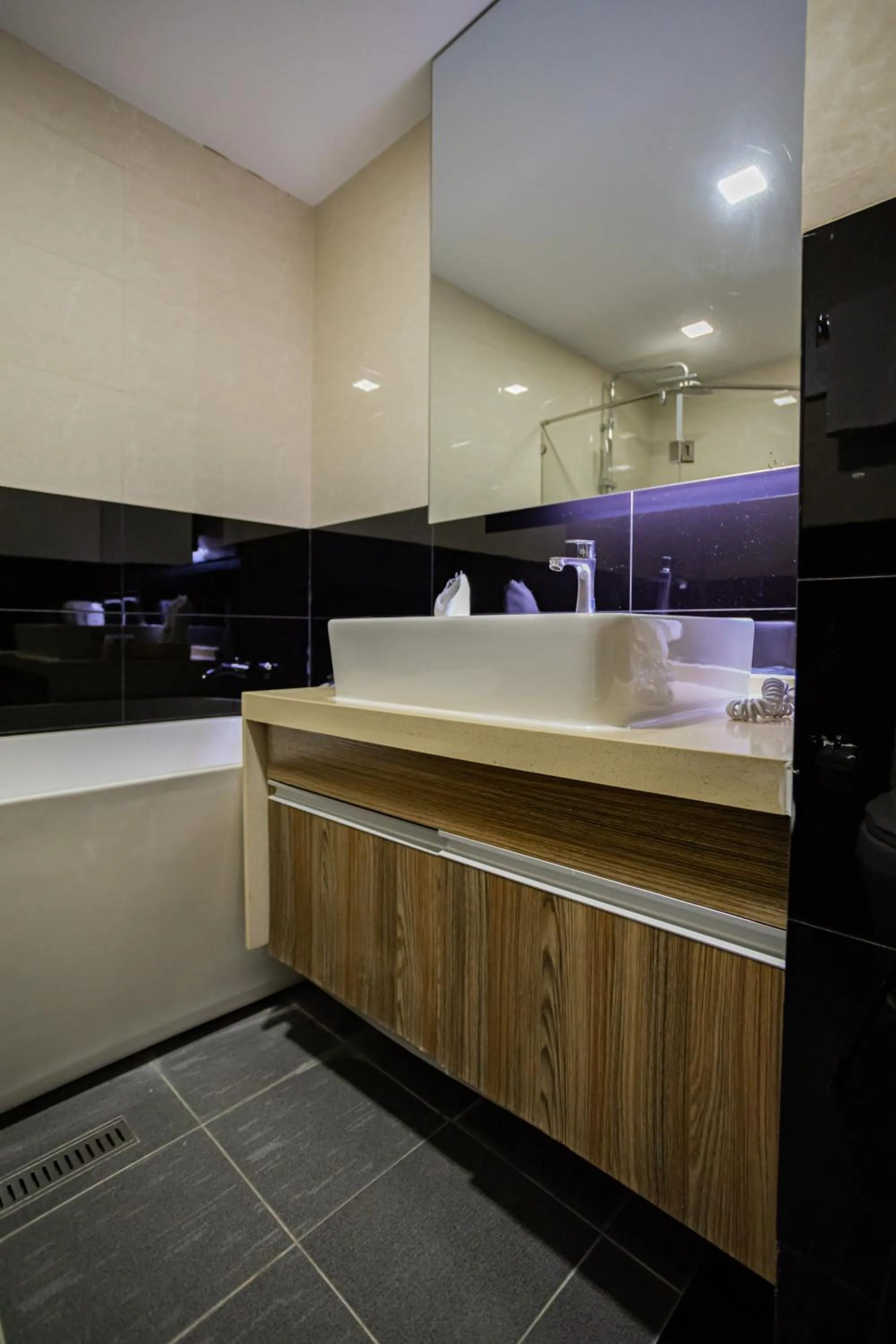 Bathroom in Ramada by Wyndham Bangkok Ten Ekamai Residences