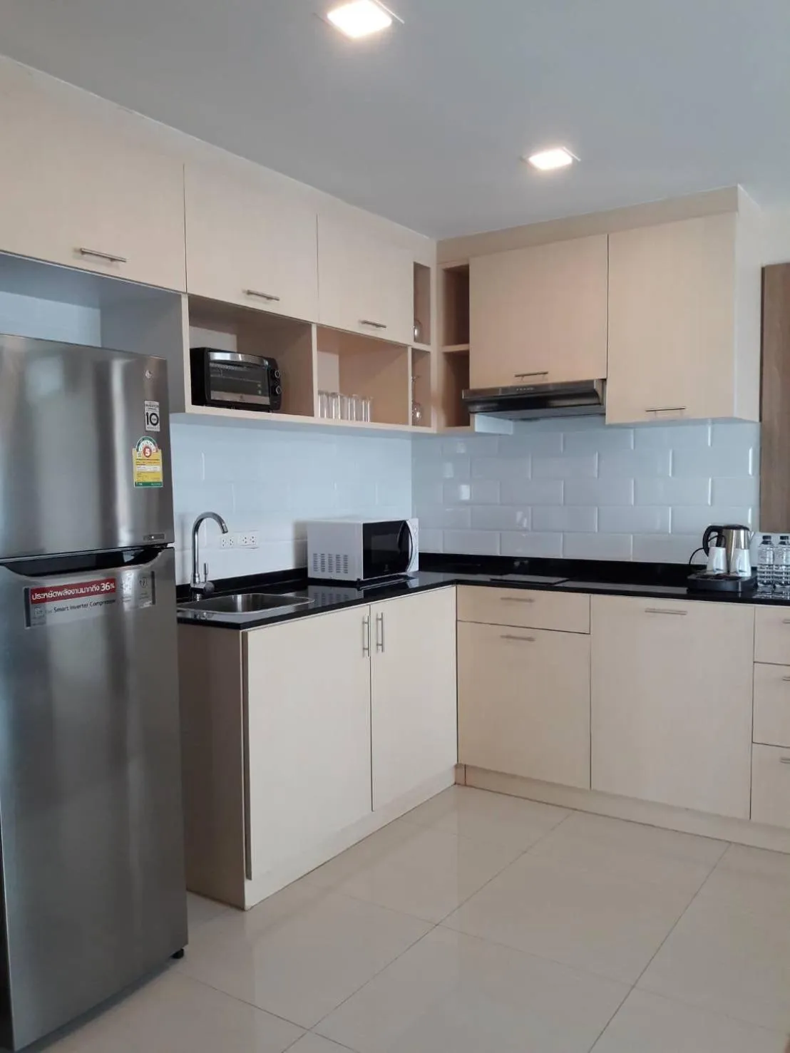 Kitchen or kitchenette in Ramada by Wyndham Bangkok Ten Ekamai Residences