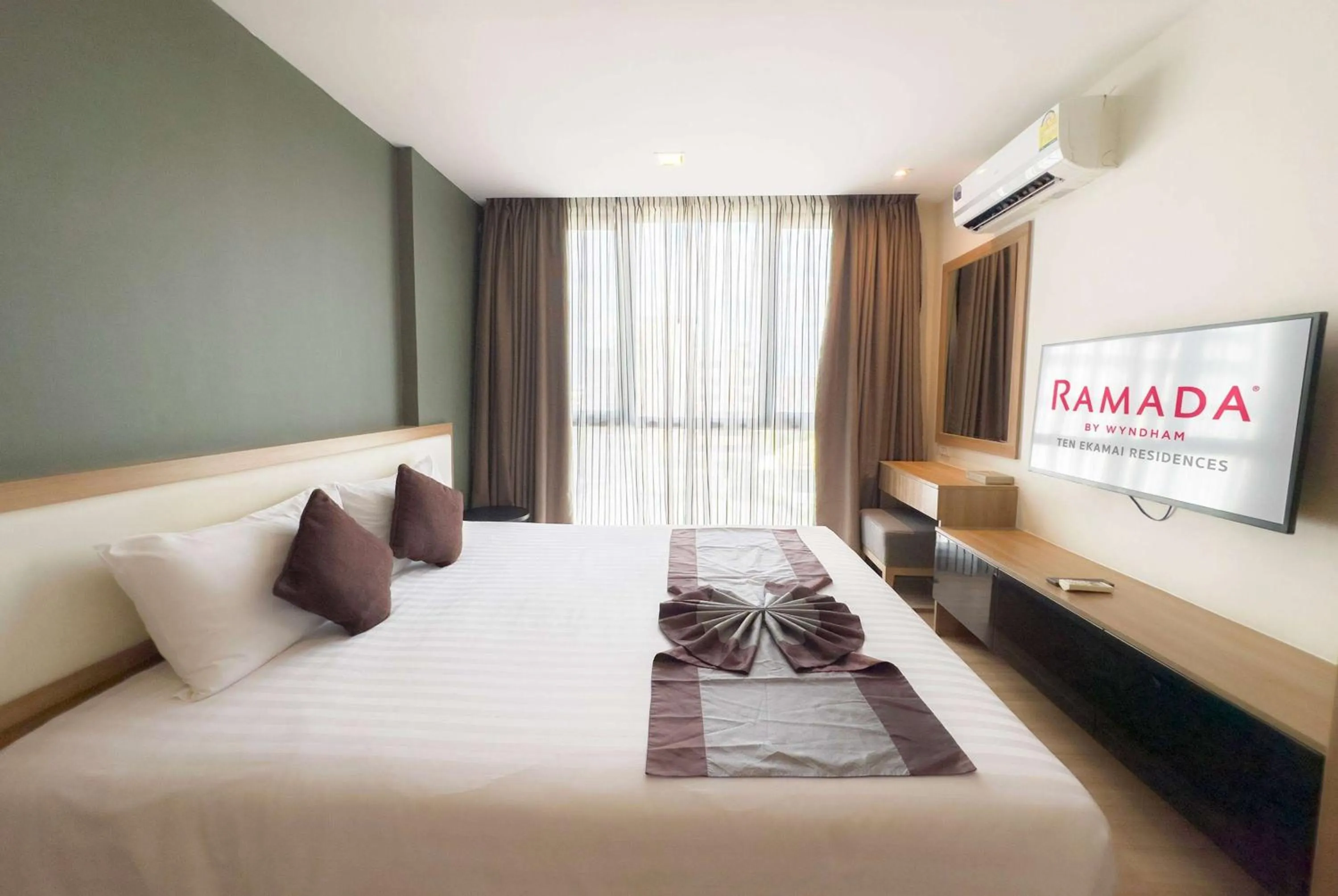 Photo of the whole room, Bed in Ramada by Wyndham Bangkok Ten Ekamai Residences
