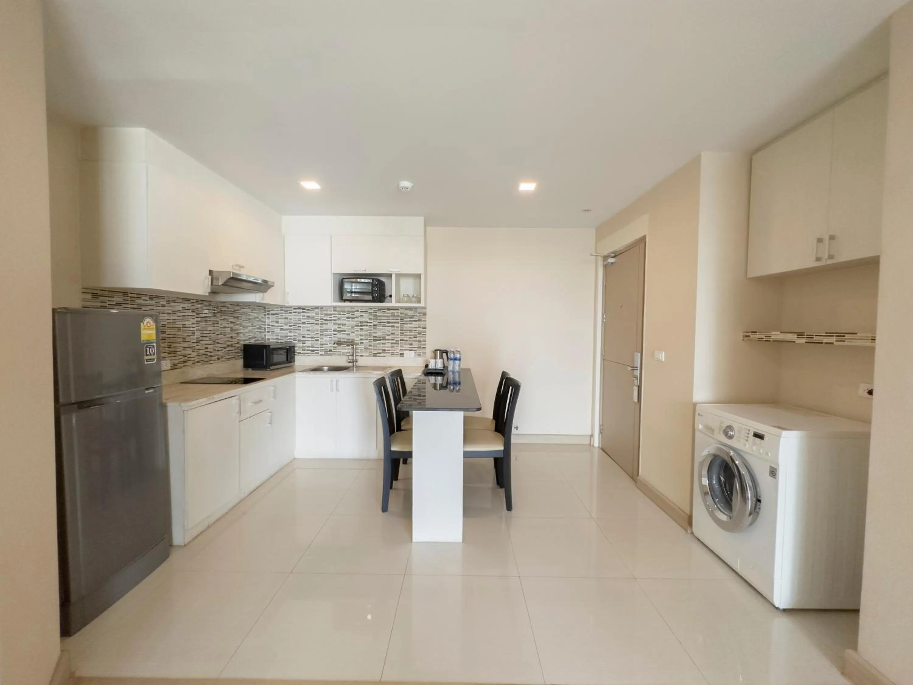 Kitchen or kitchenette in Ramada by Wyndham Bangkok Ten Ekamai Residences