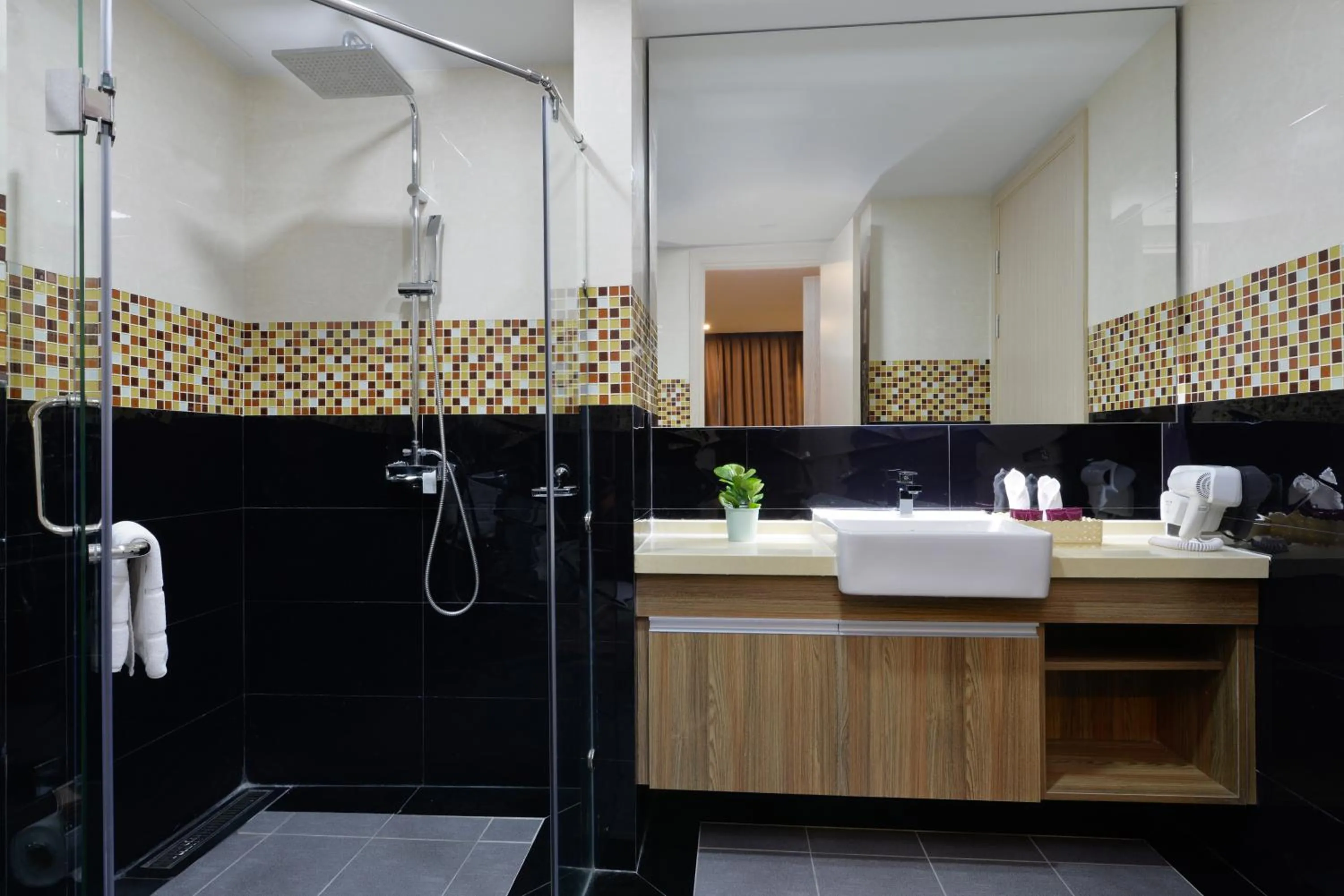 Shower in Ramada by Wyndham Bangkok Ten Ekamai Residences