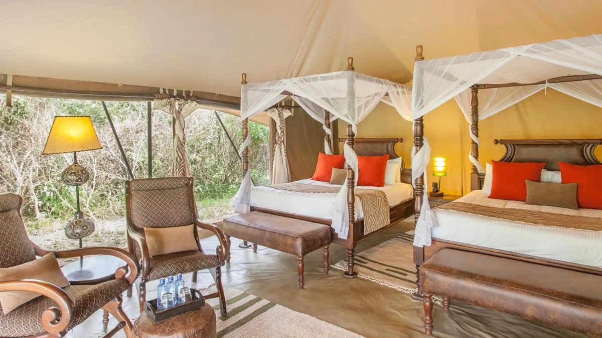 Bed in Mara Ngenche Safari Camp - Maasai Mara National Reserve