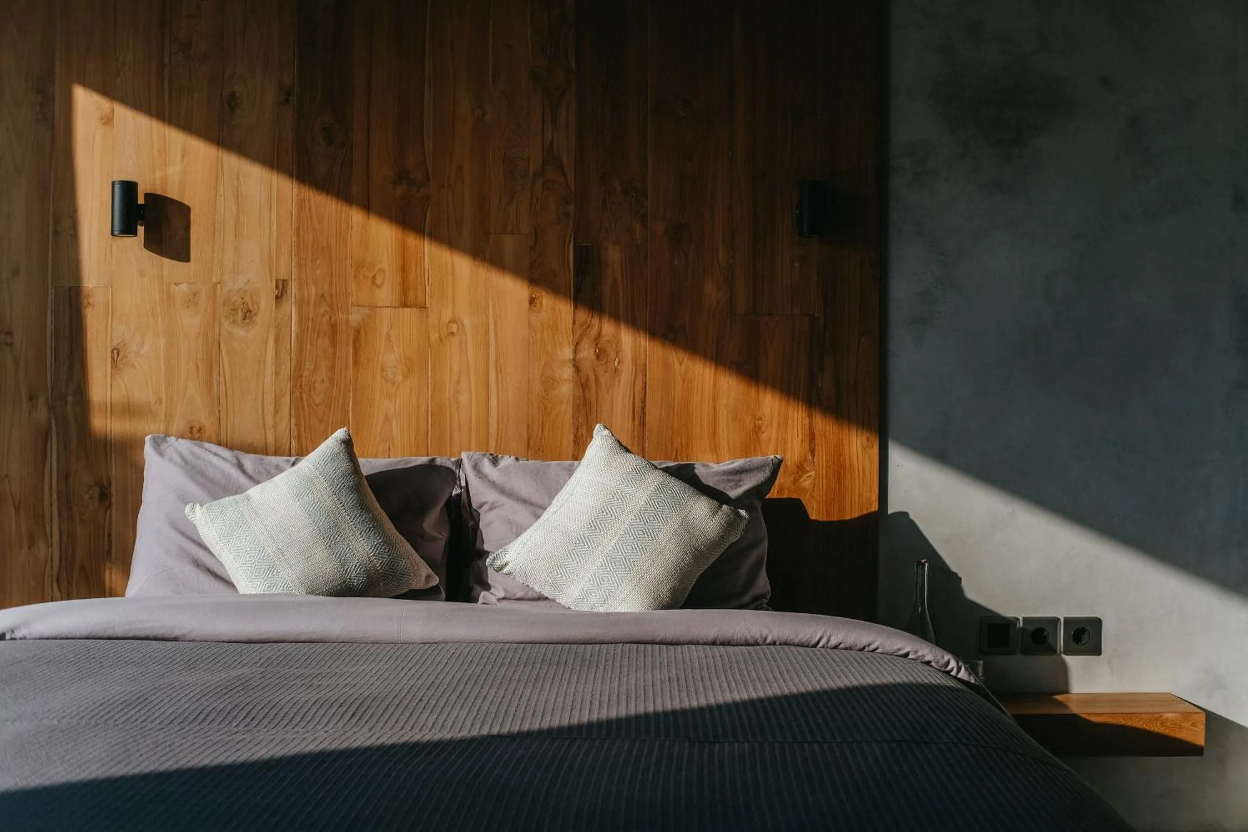 Bed in Concrete Retreat Villa