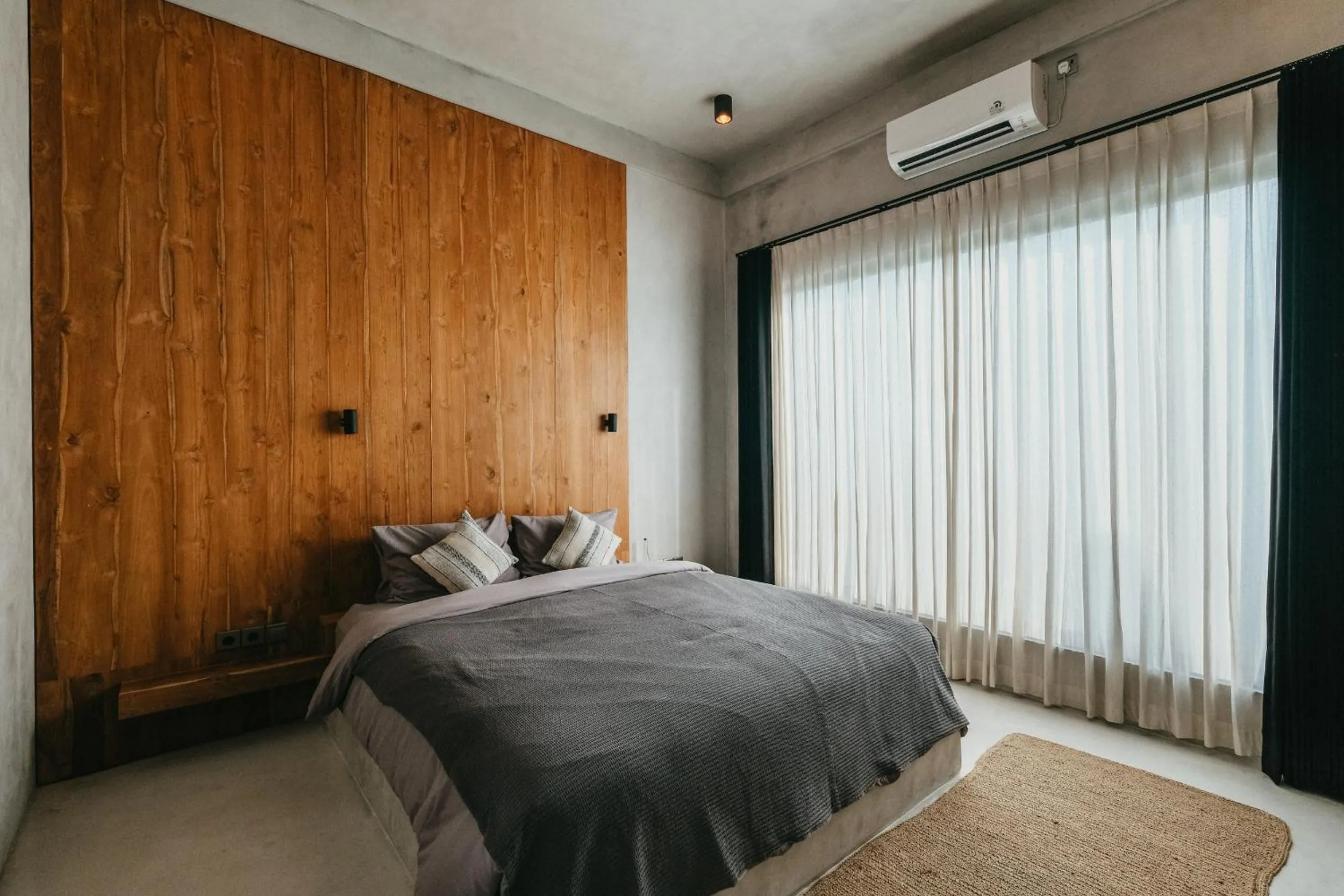 Bed in Concrete Retreat Villa