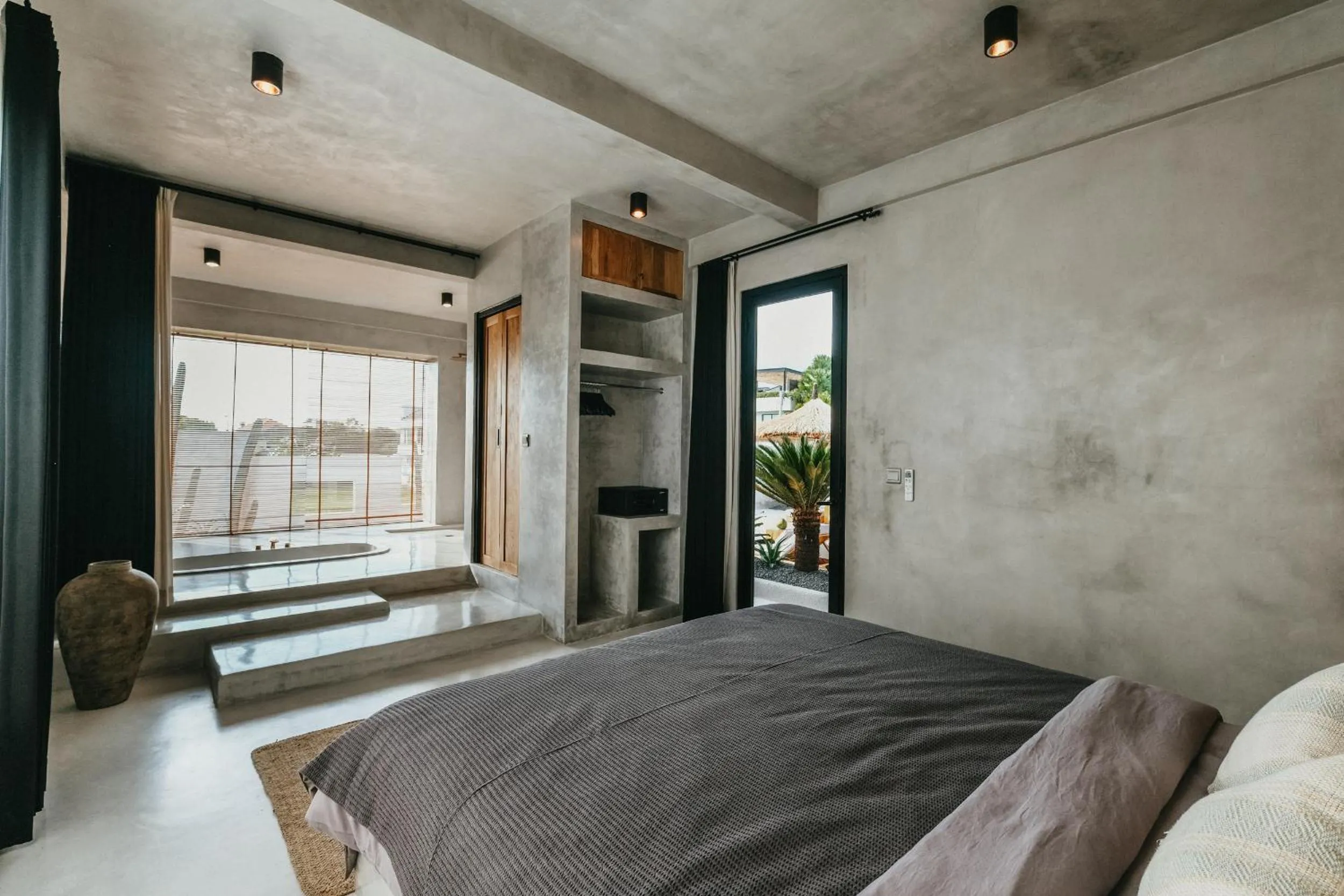 Bed in Concrete Retreat Villa