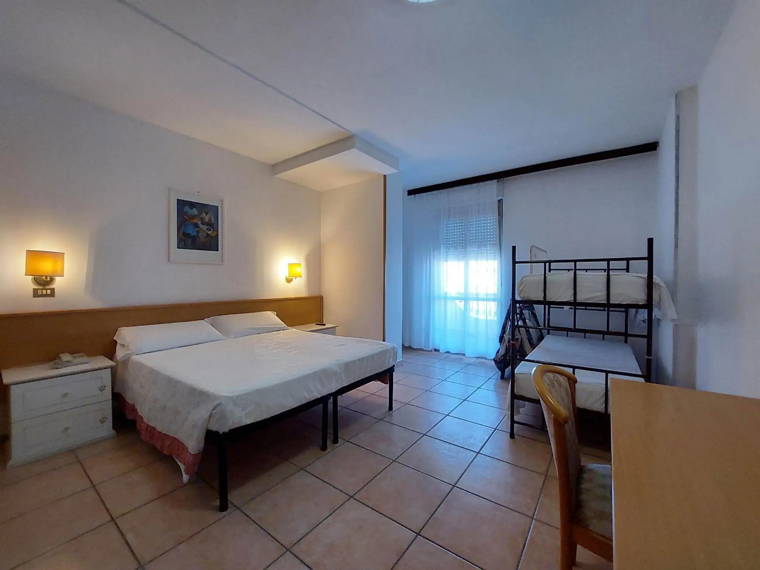 Quadruple Room - single occupancy in Hotel Nettuno Quadruple Room - single occupancy in Hotel Nettuno