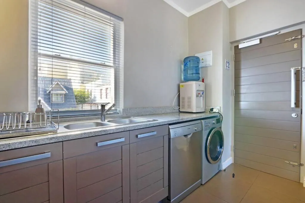 Kitchen or kitchenette in Penguin Haven . Luxury 2 bedroom, Boulders Beach.