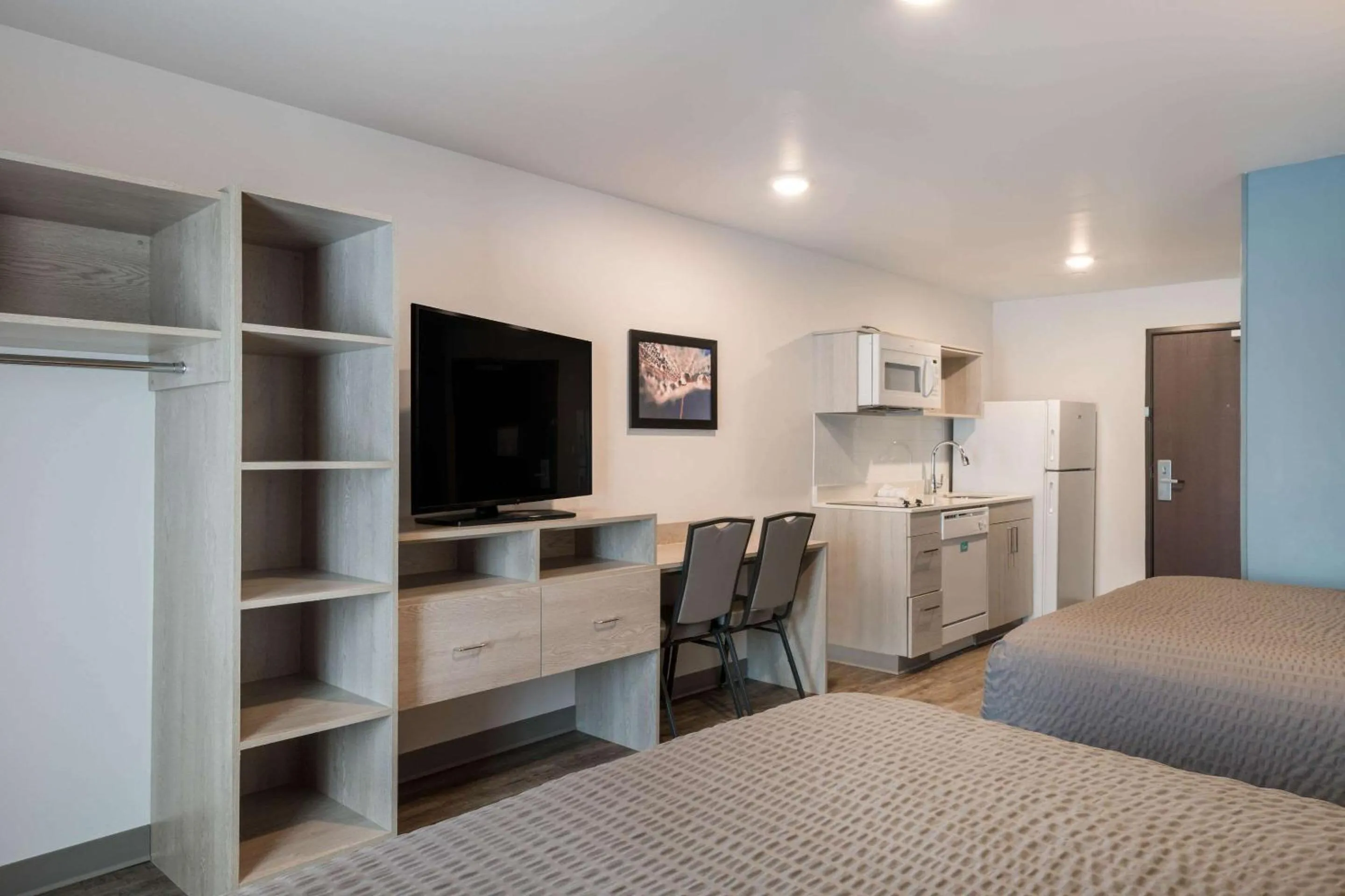 Photo of the whole room, Bed in WoodSpring Suites Concord-Charlotte Speedway