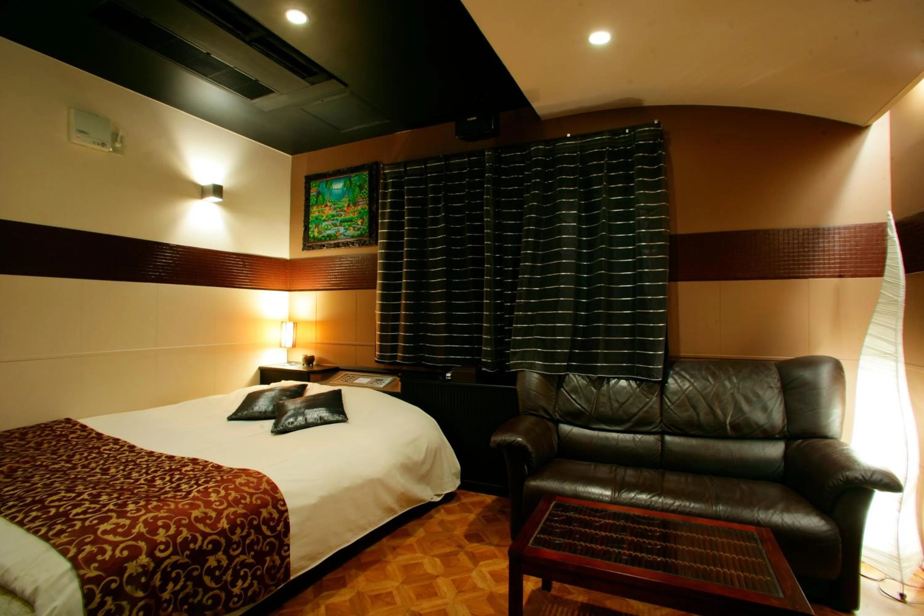 Bed in HOTEL CHECK INN BALI adult only