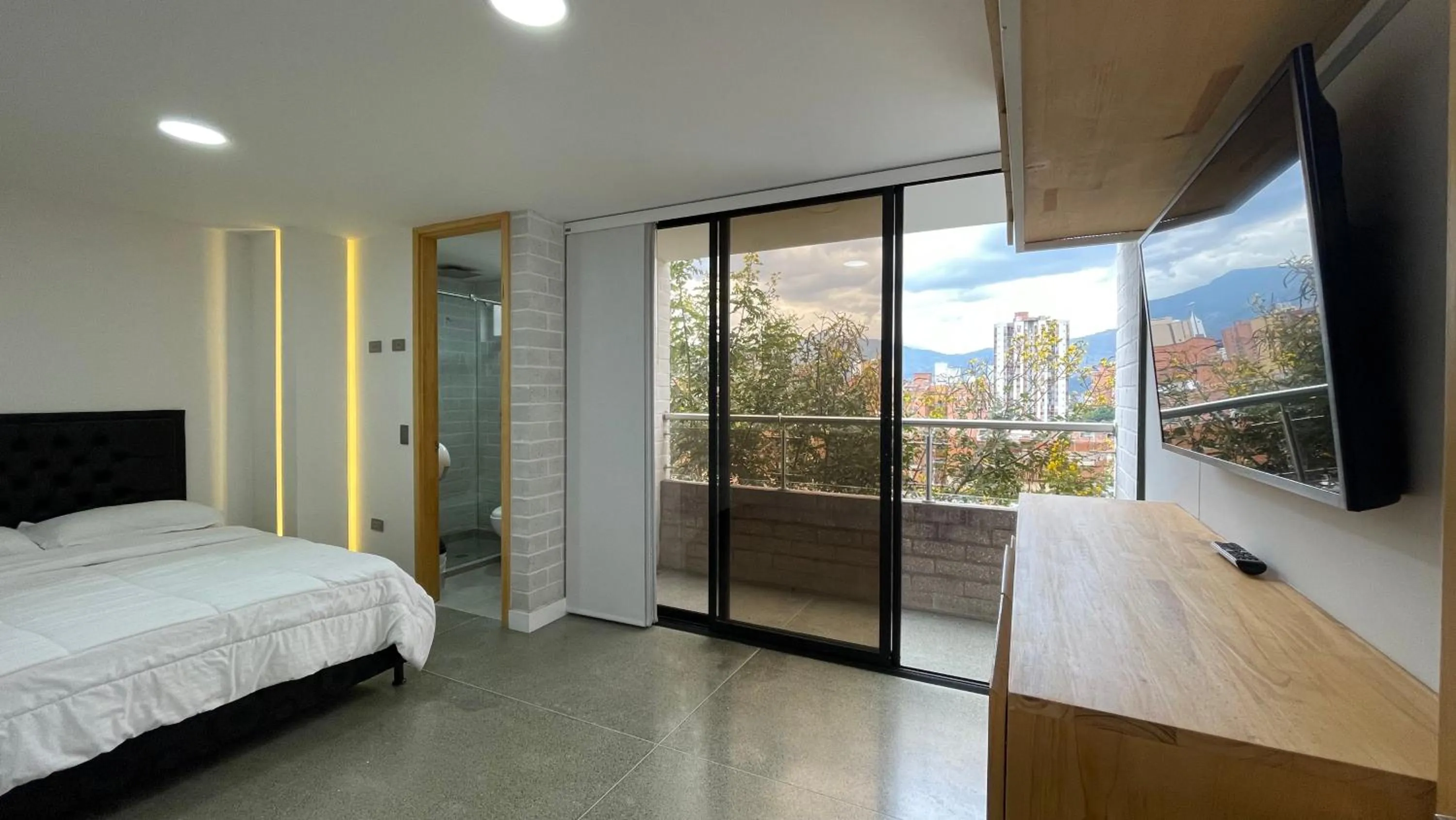 Communal lounge/ TV room, Bed in Edificio Helena