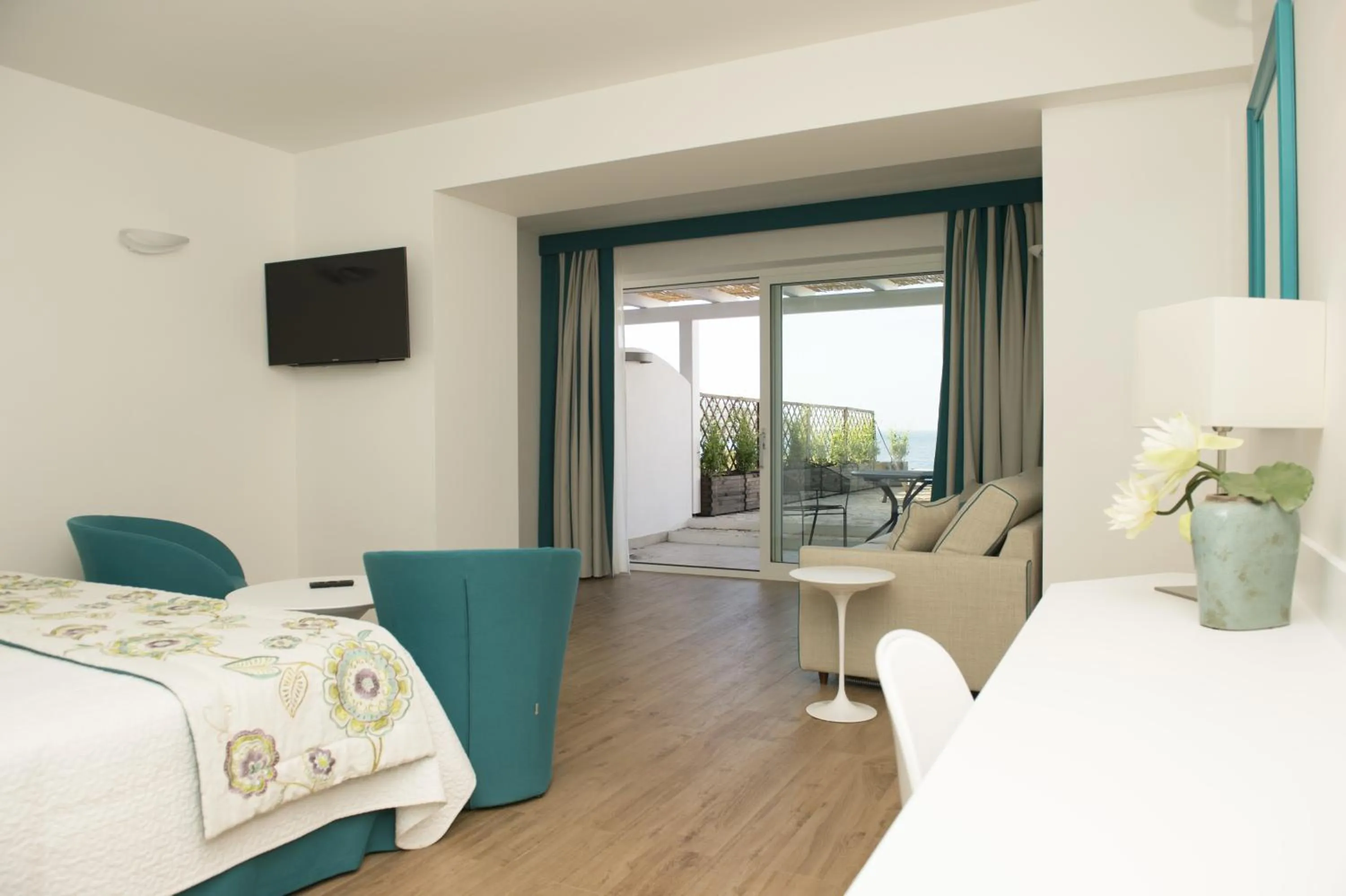 Photo of the whole room, Bed in El Faro Hotel & Spa