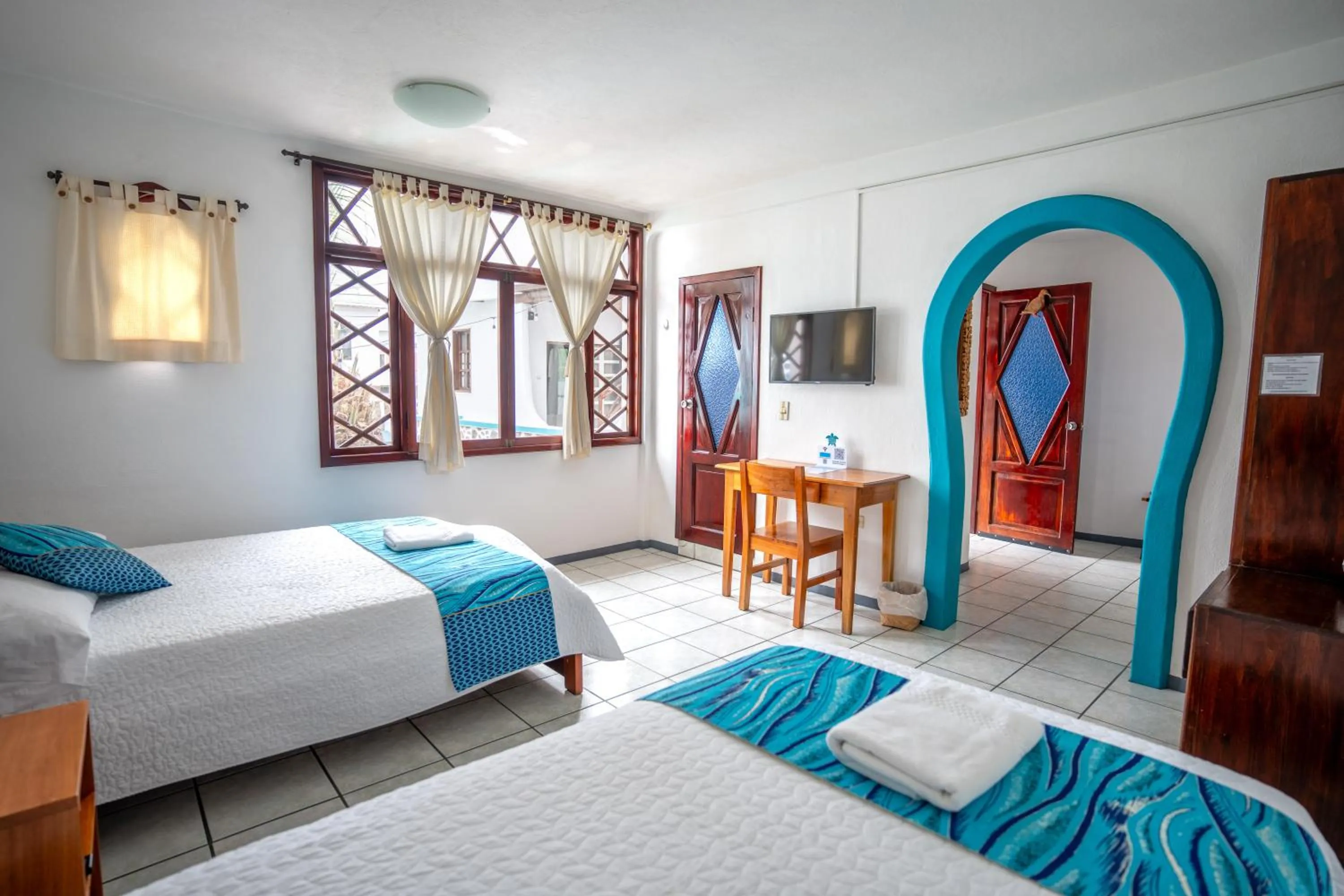 Bed in Maidith Galapagos Inn