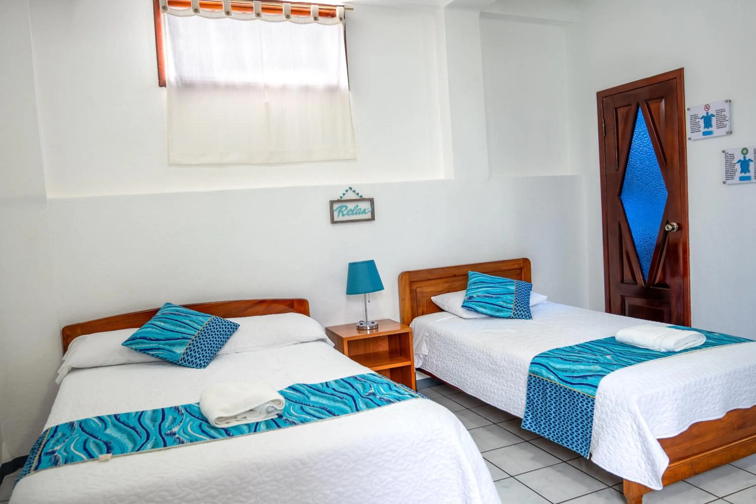 Bed in Maidith Galapagos Inn