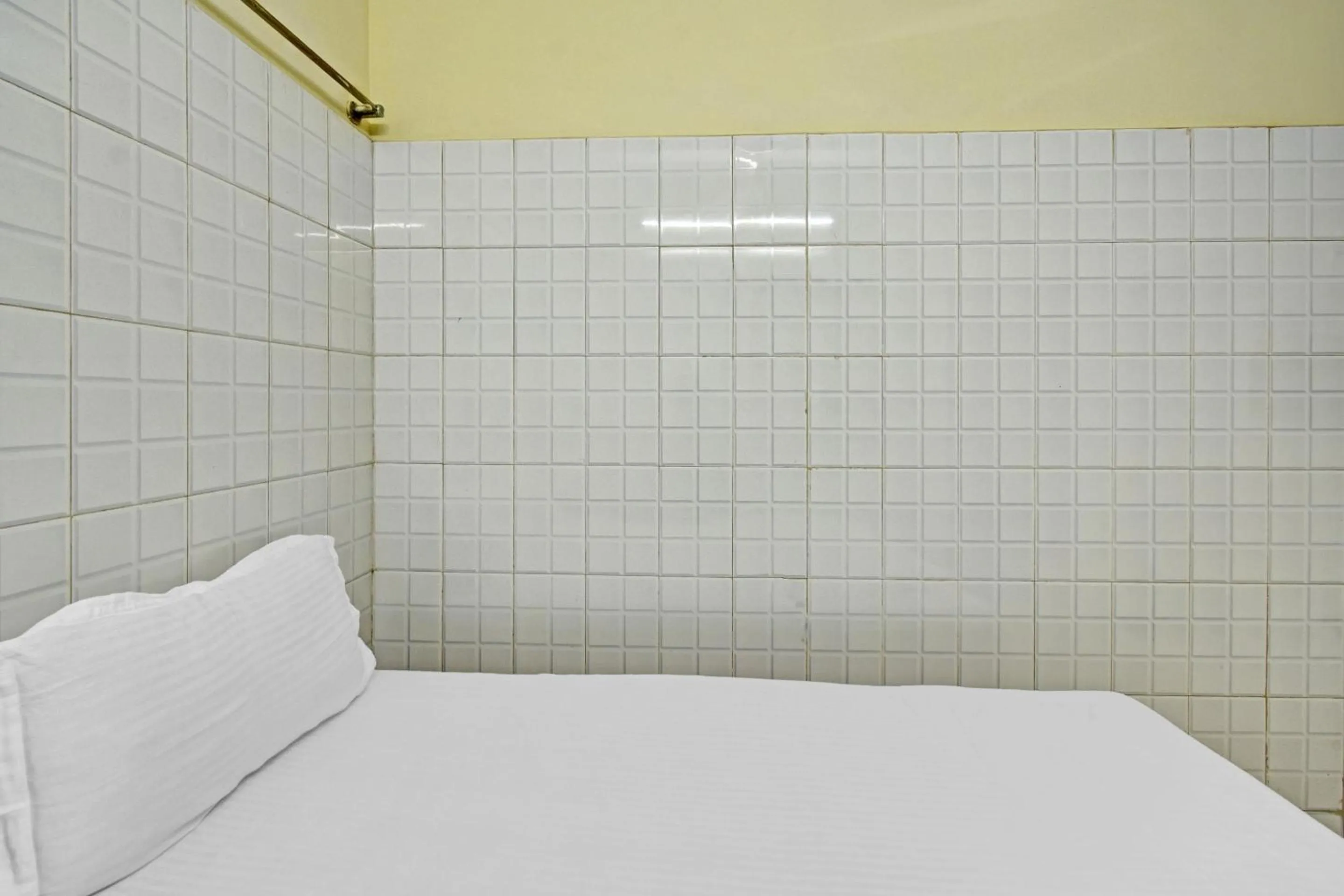 Bedroom in Hotel O Dream Palace Guest House Near Marina Beach