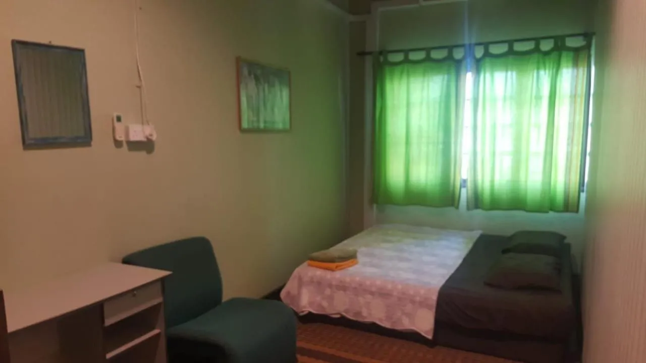Bed in Marco Polo Guest House