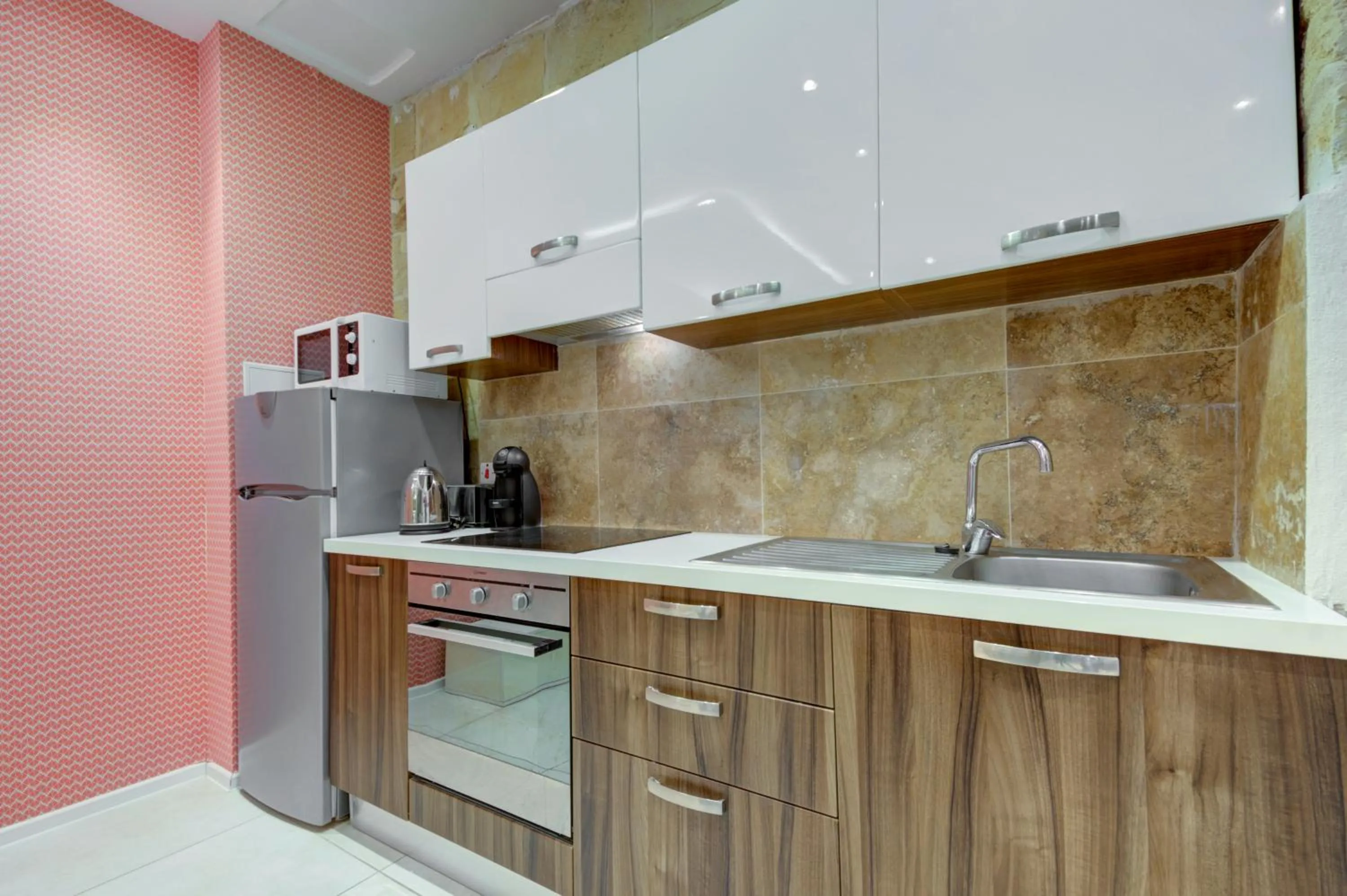 Kitchen or kitchenette in Tritoni Harbour suites - Valletta
