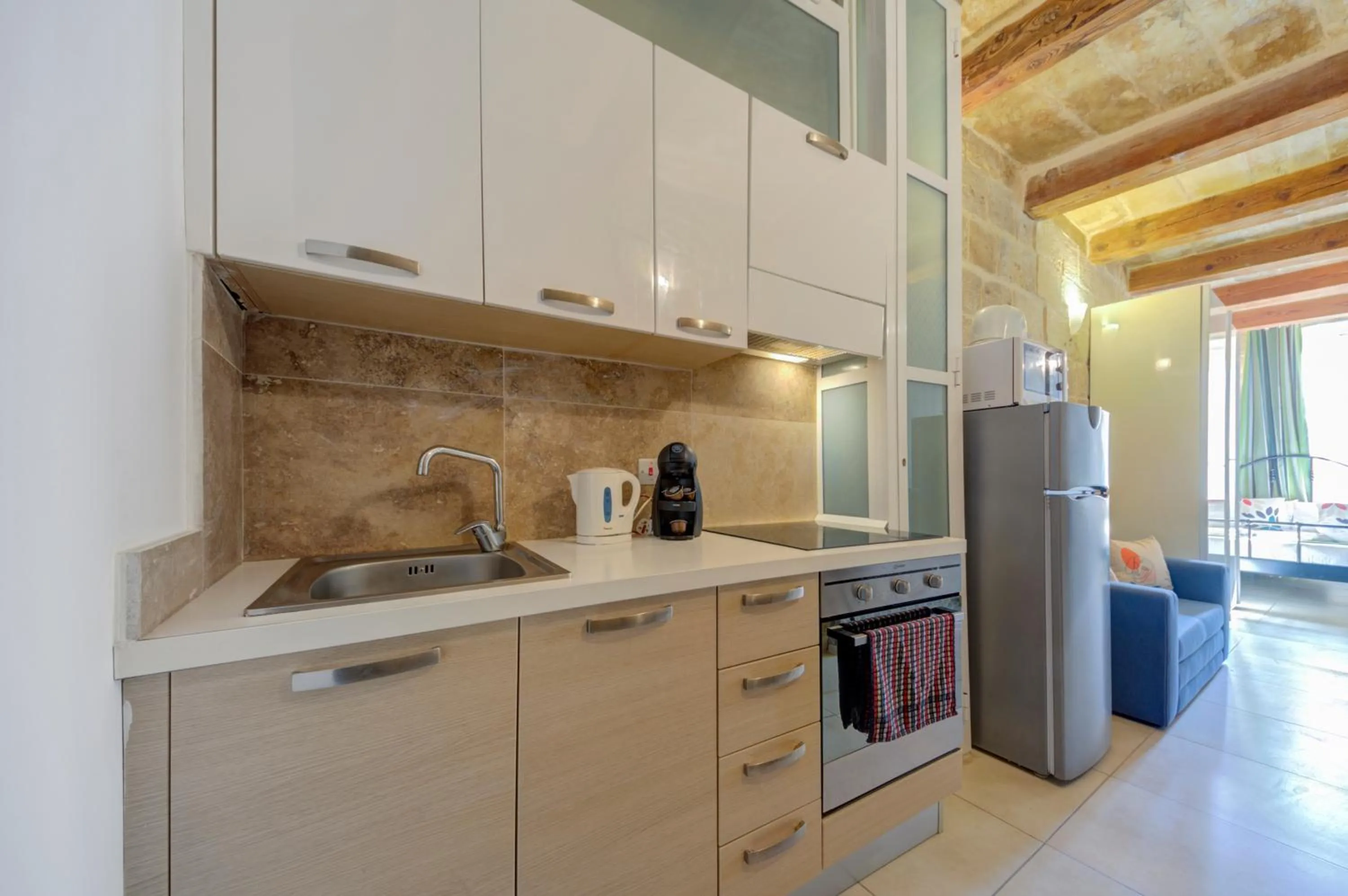Kitchen or kitchenette in Tritoni Harbour suites - Valletta