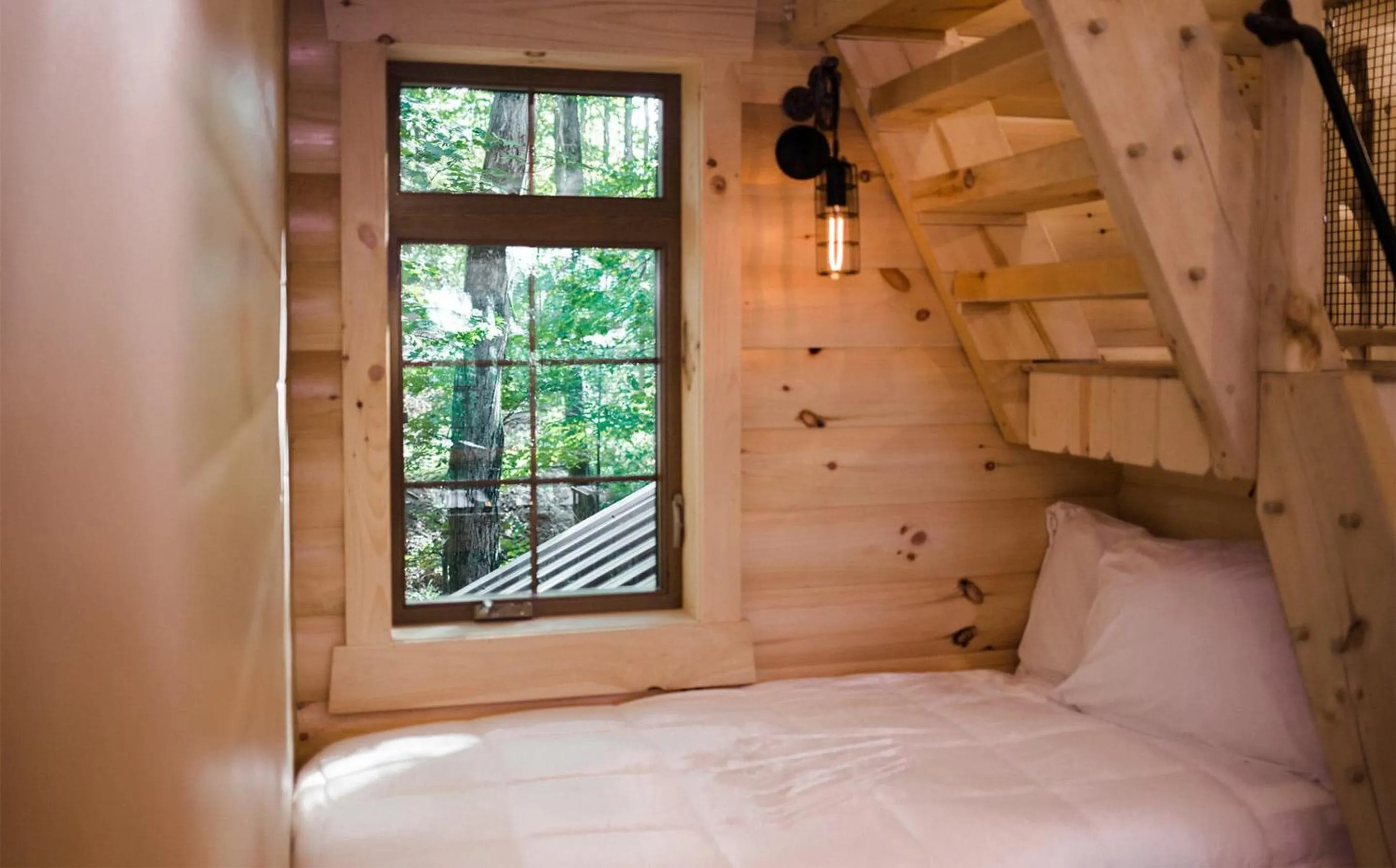 Bed in Treehouse #1 by Amish Country Lodging