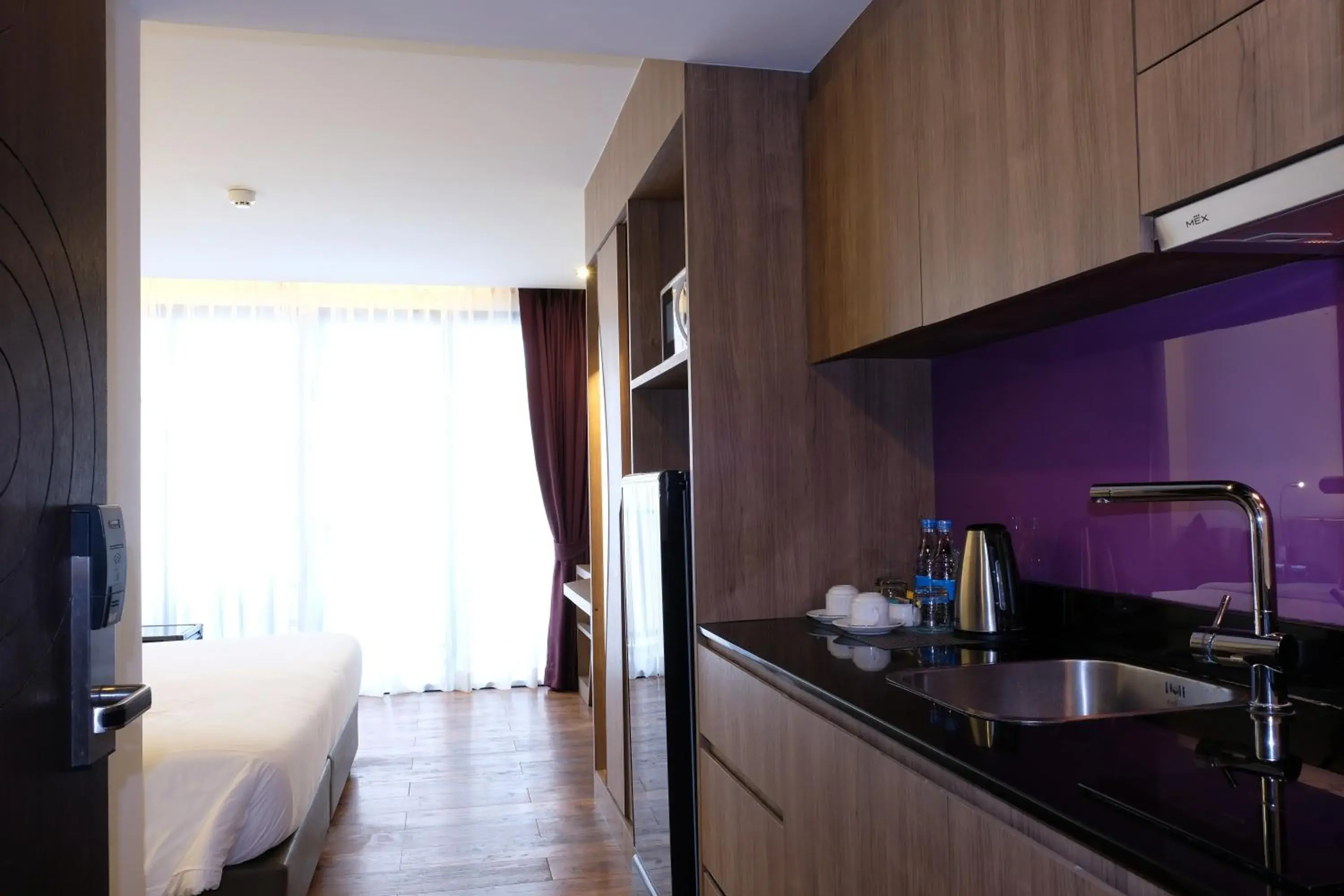 Kitchen or kitchenette, Bed in The Beach Heights Resort SHA Plus Kitchen or kitchenette, Bed in The Beach Heights Resort SHA Plus