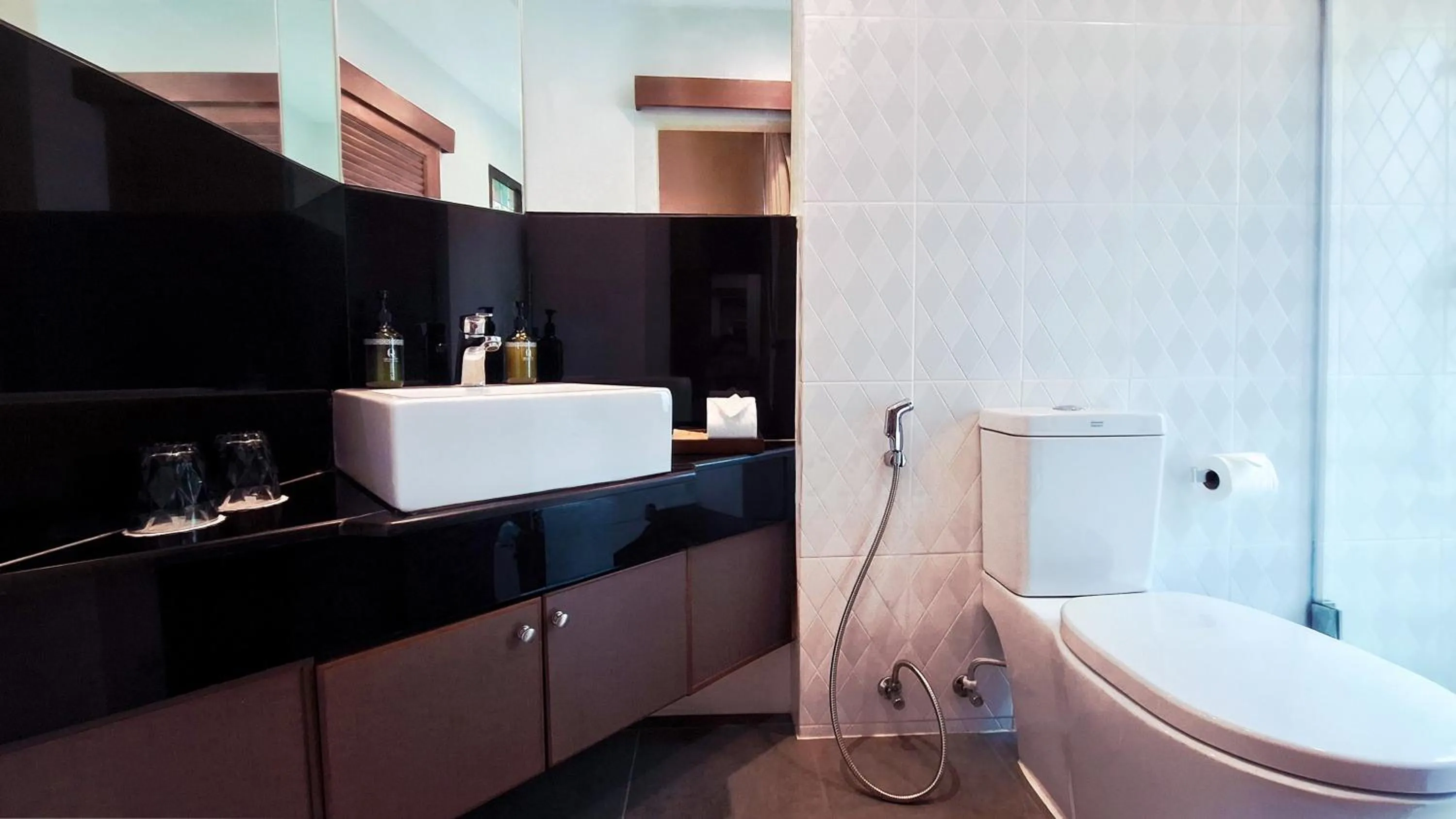 Toilet in Quality Beach Resorts and Spa Patong