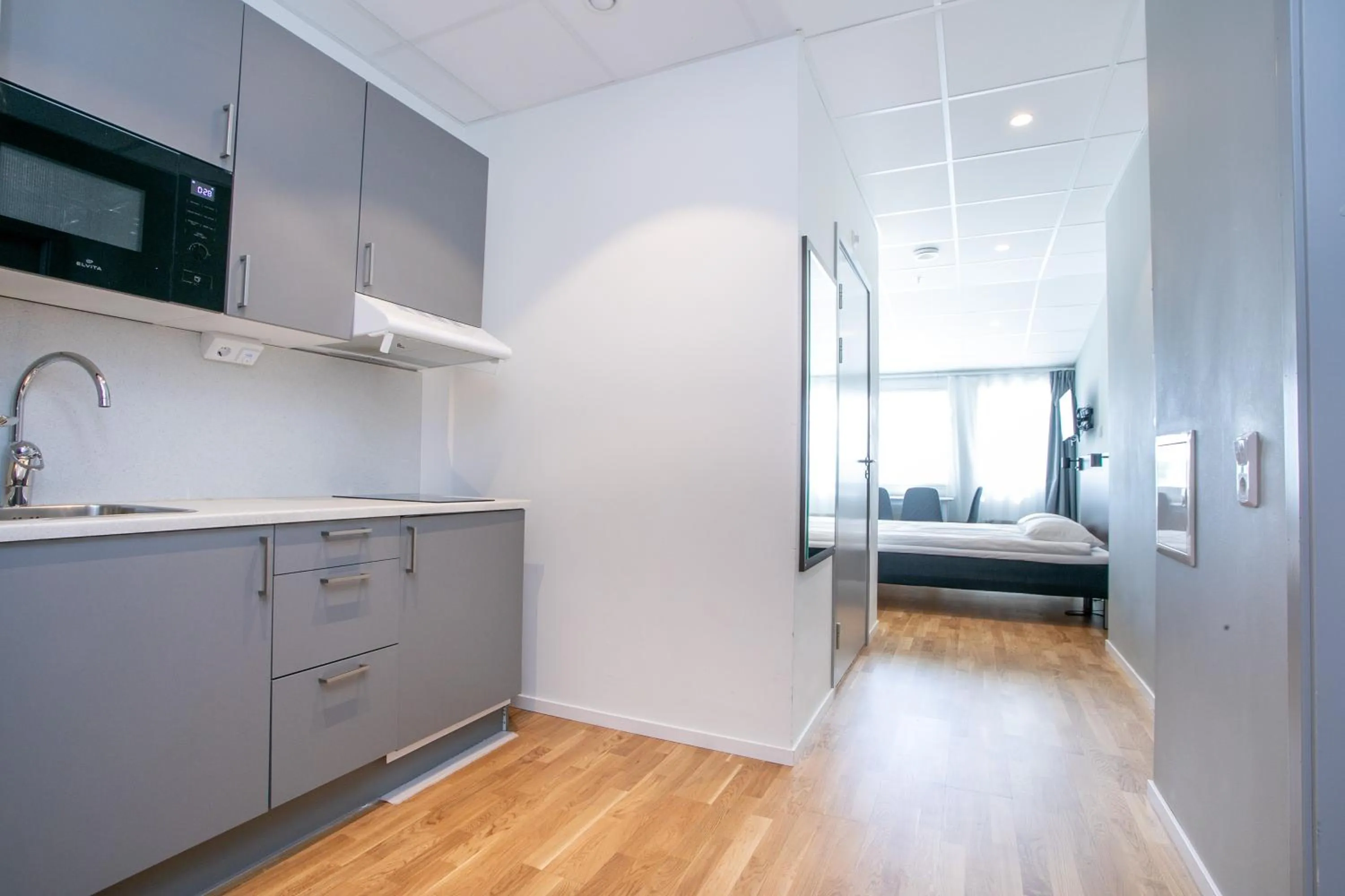 Kitchen or kitchenette, Bed in ApartDirect Arlandastad