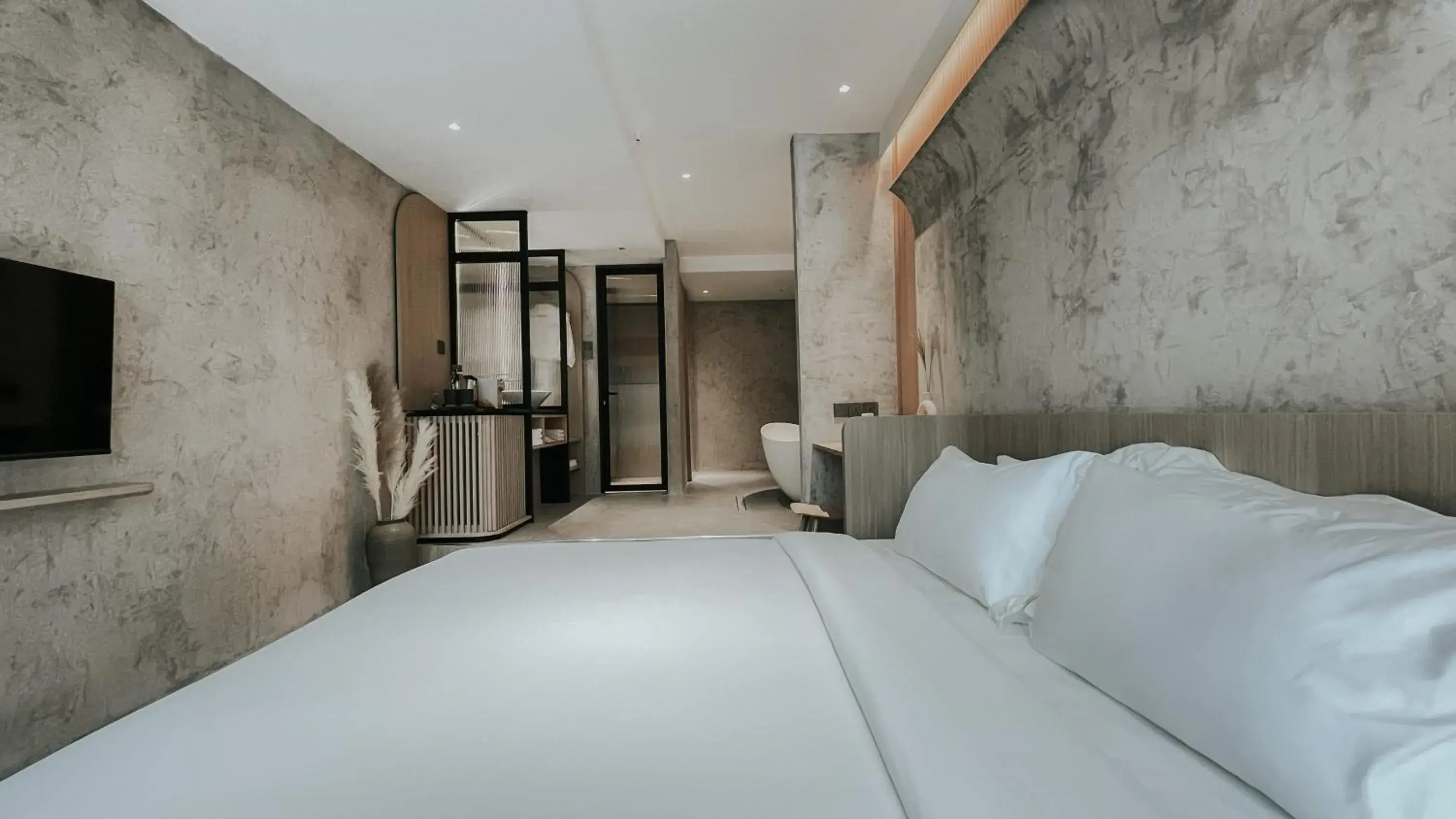 Bed in The Cara Boutique Hotel