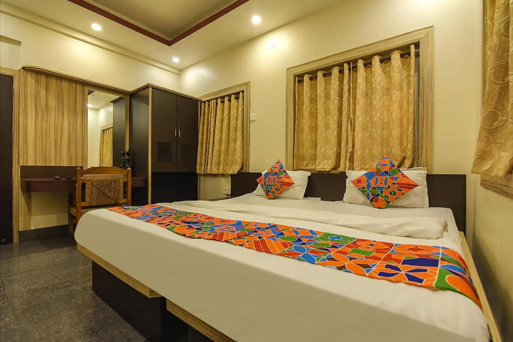 Bed in FabHotel Shivalya