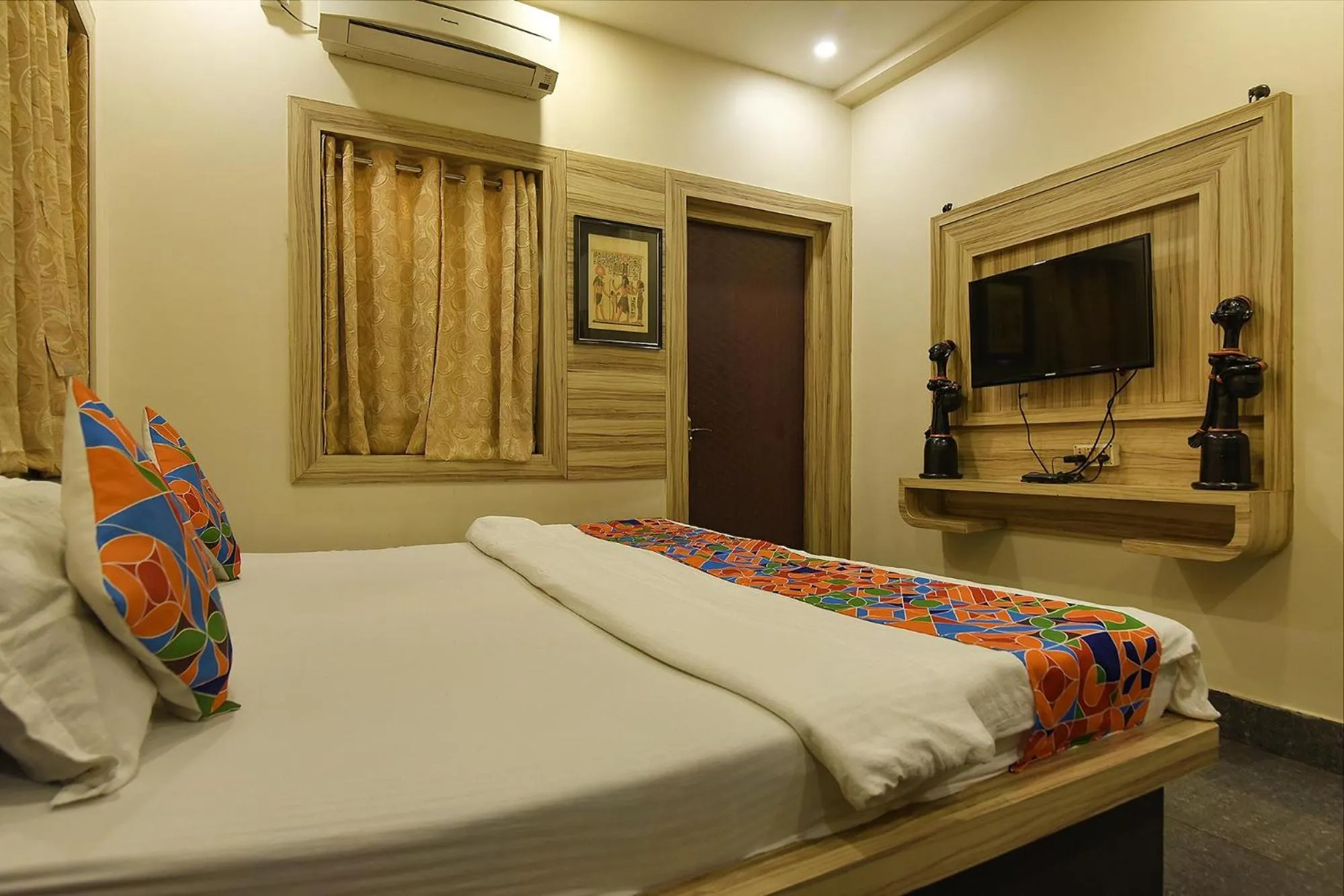 Bed in FabHotel Shivalya
