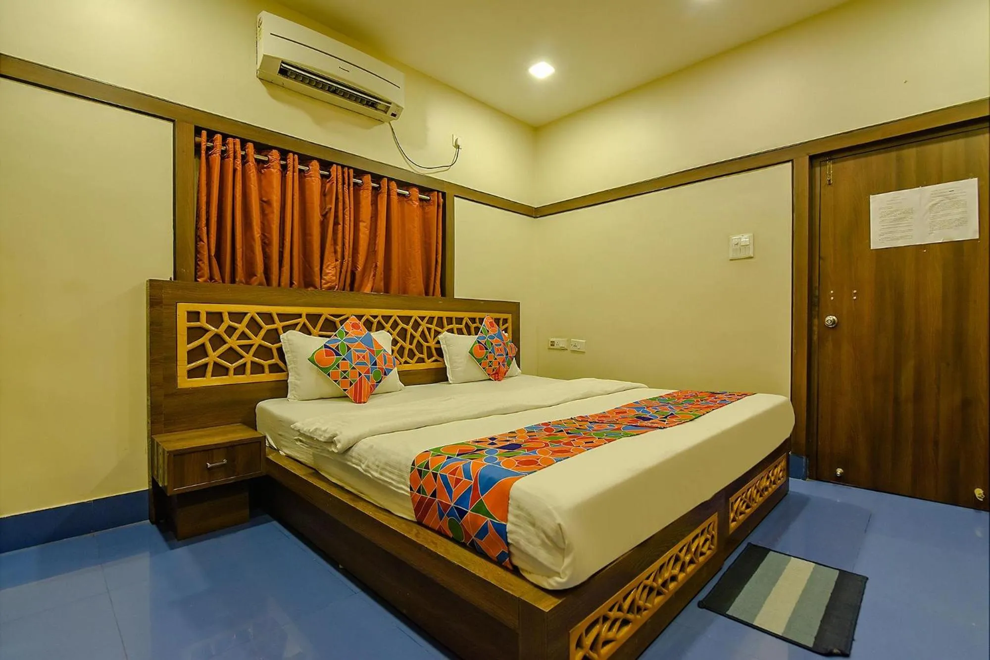 Bed in FabHotel Shivalya