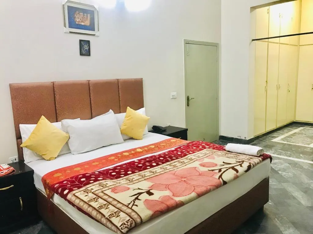 Photo of the whole room, Bed in Hotel Rose Inn Lahore